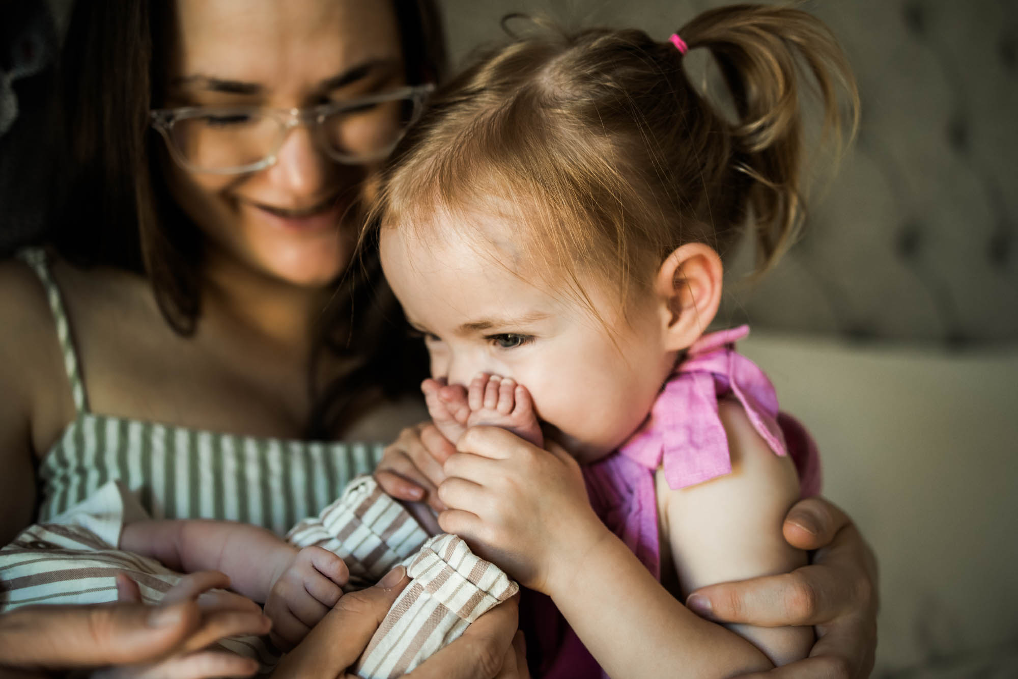 Calgary lifestyle maternity and newborn photographer, family with their newborn baby during their in-home photo session