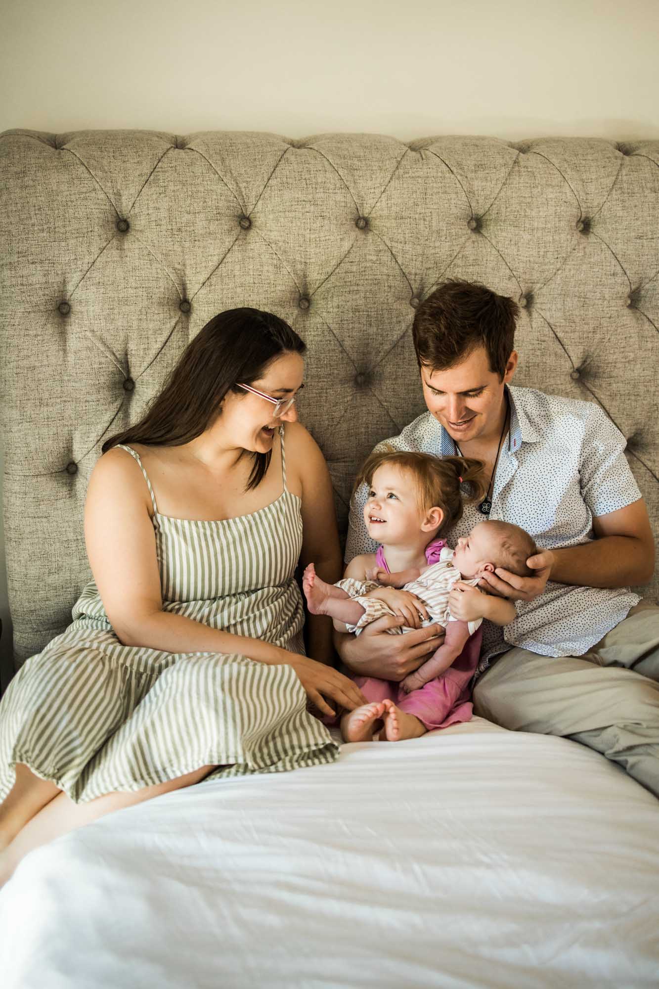 Calgary lifestyle maternity and newborn photographer, family with their newborn baby during their in-home photo session