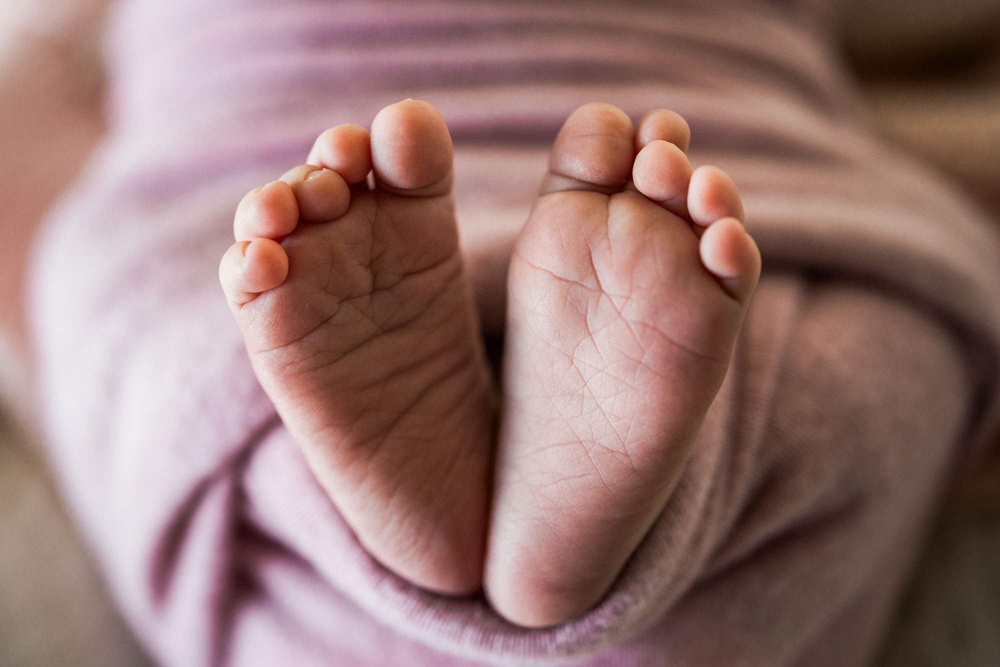 Calgary lifestyle maternity and newborn photographer, family with their newborn baby during their in-home photo session