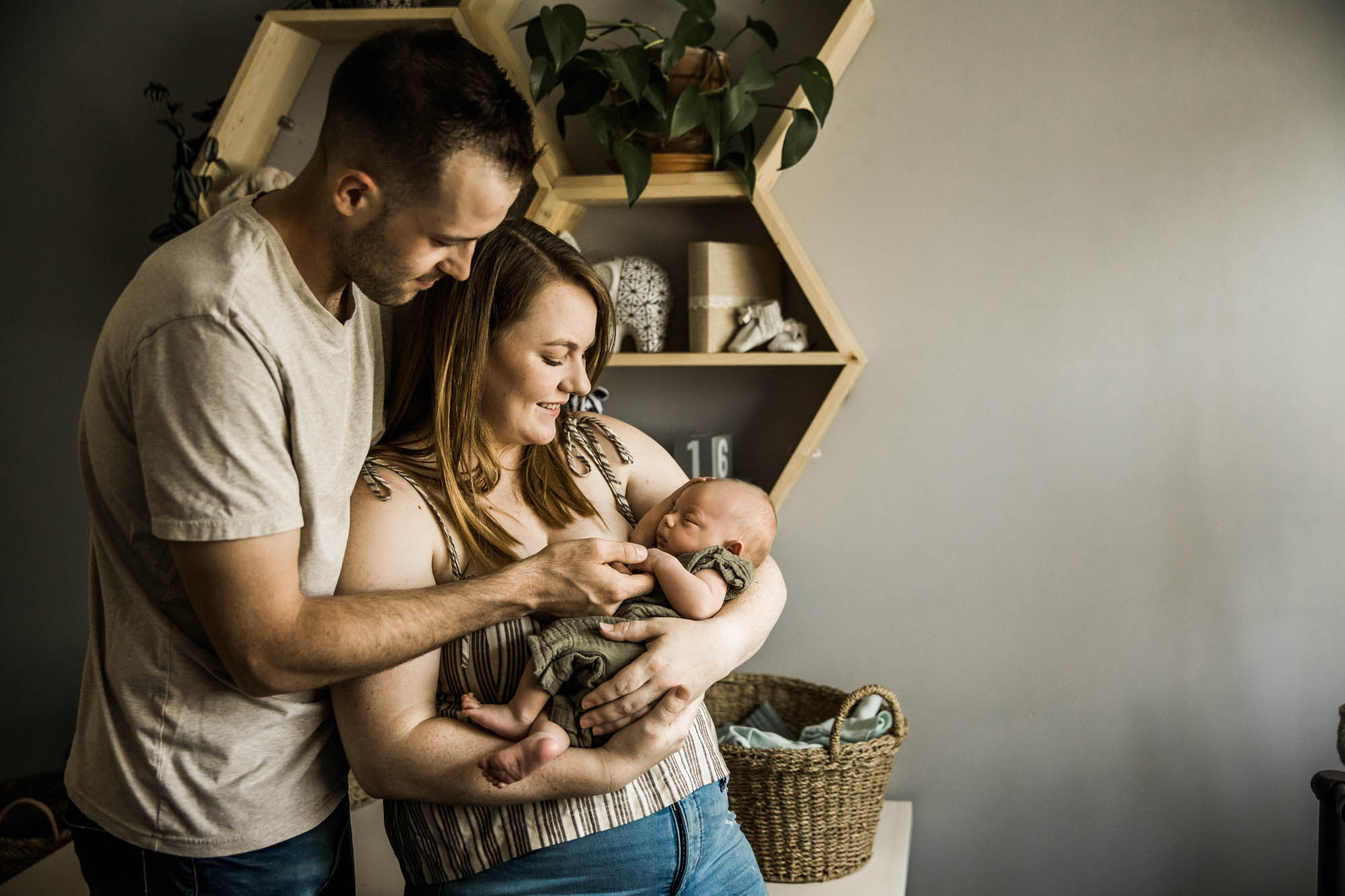 Calgary lifestyle maternity and newborn photographer, family with their newborn baby during their in-home photo session