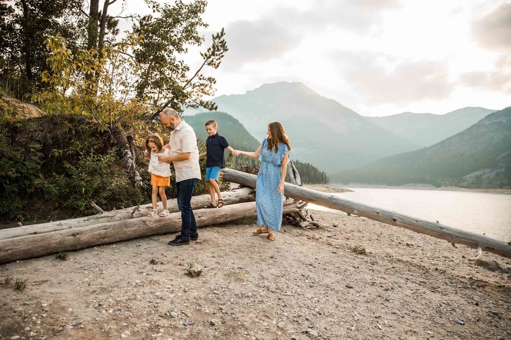 Calgary, Banff, Kananaskis Country lifestyle family photographer, natural and candid photos of a family in front of the mountains at Barrier Lake