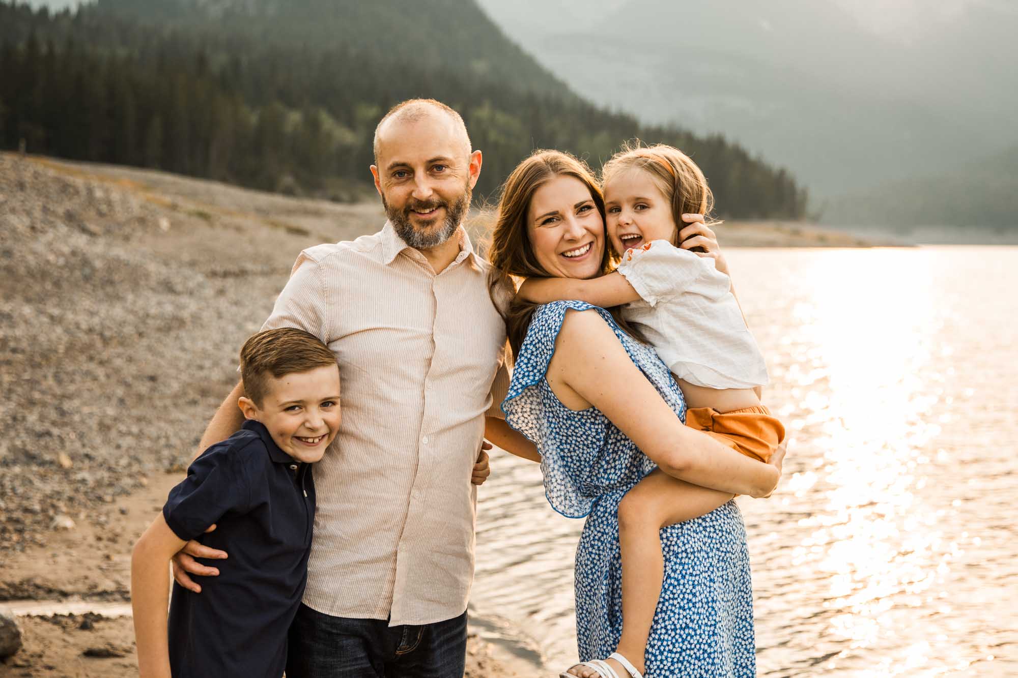 Calgary, Banff, Kananaskis Country lifestyle family photographer, natural and candid photos of a family in front of the mountains at Barrier Lake