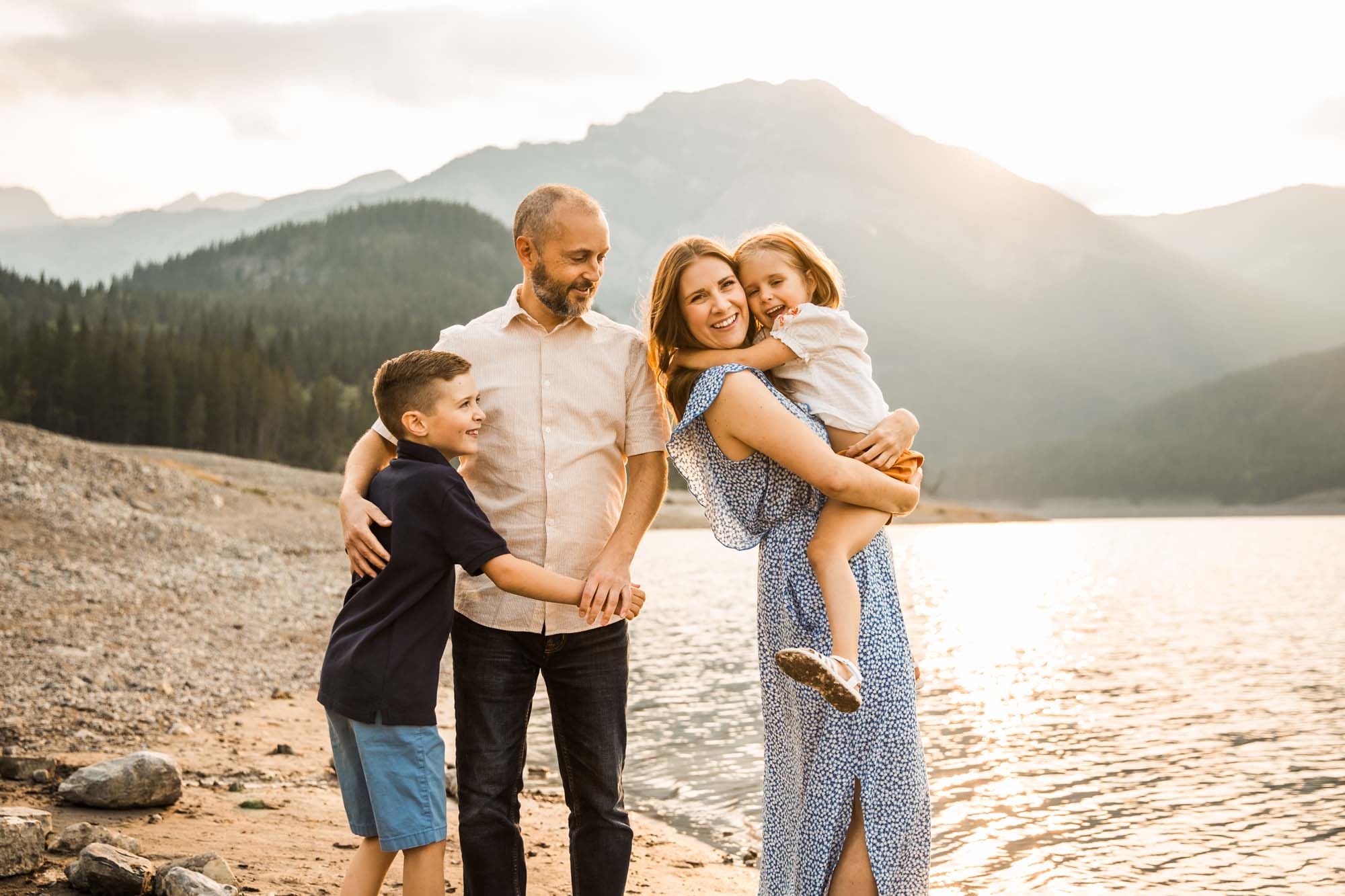 Calgary, Banff, Kananaskis Country lifestyle family photographer, natural and candid photos of a family in front of the mountains at Barrier Lake