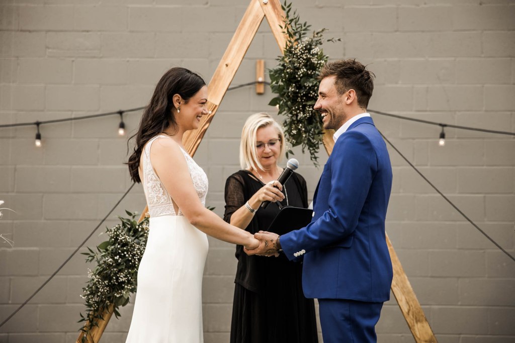 Calgary wedding photographer, candid photos of a micro intimate wedding at Two House Brewery small casual restaurant downtown Calgary