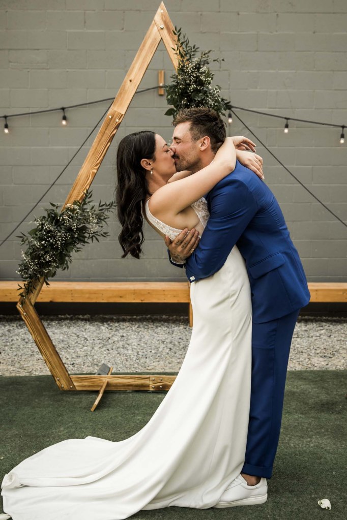 Calgary wedding photographer, candid photos of a micro intimate wedding at Two House Brewery small casual restaurant downtown Calgary