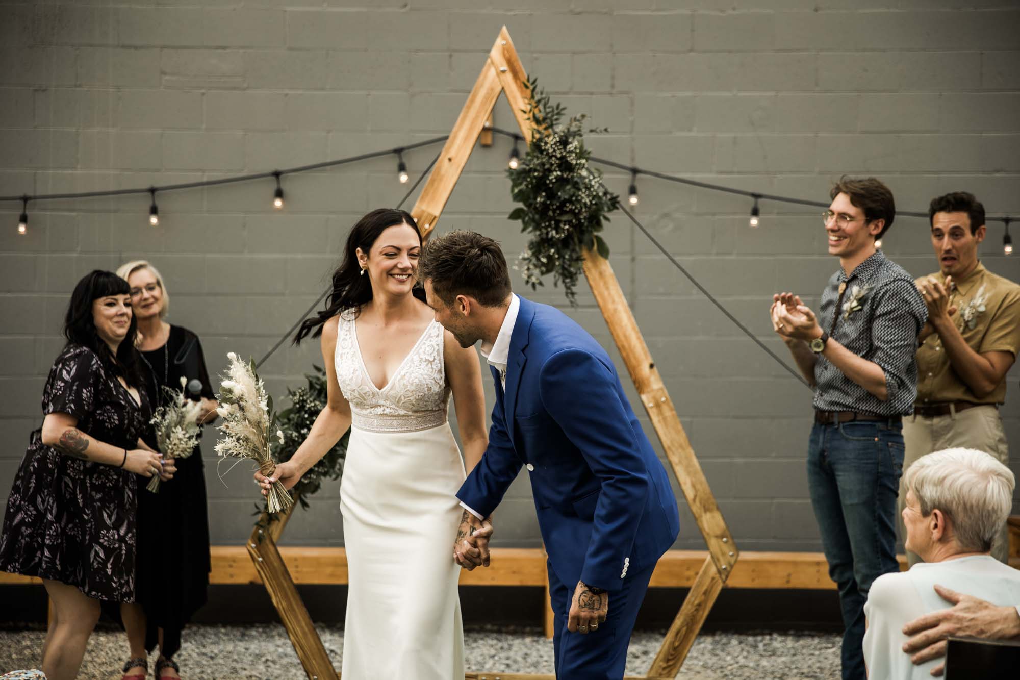 Calgary wedding photographer, candid photos of a micro intimate wedding at Two House Brewery small casual restaurant downtown Calgary