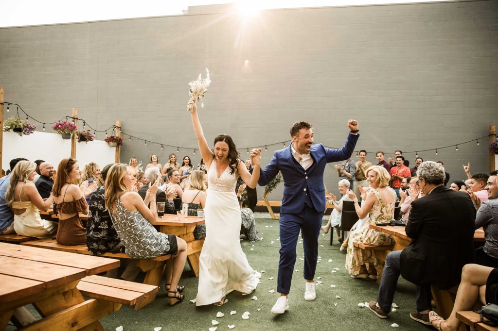 Calgary wedding photographer, candid photos of a micro intimate wedding at Two House Brewery small casual restaurant downtown Calgary