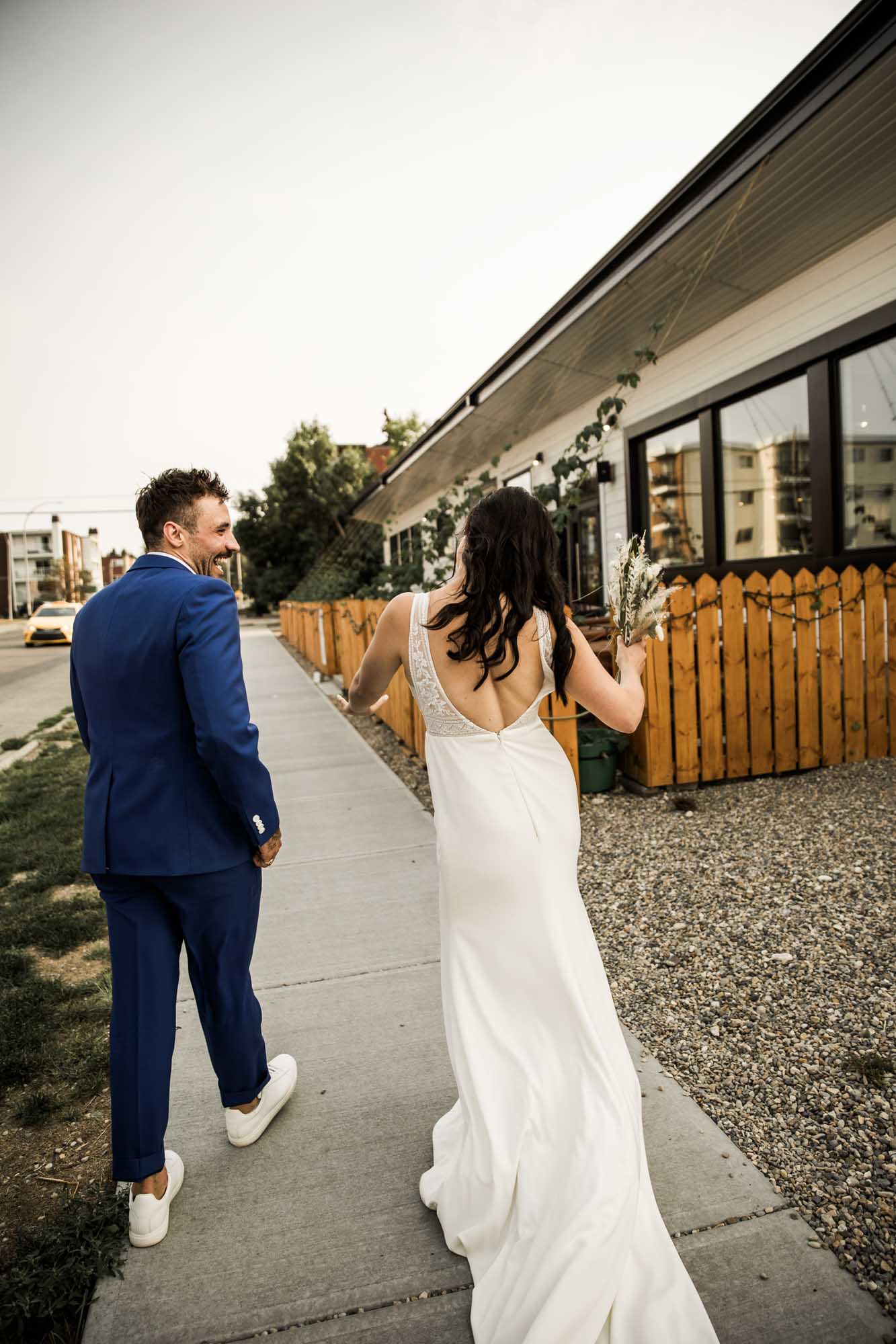 Calgary wedding photographer, candid photos of a micro intimate wedding at Two House Brewery small casual restaurant downtown Calgary