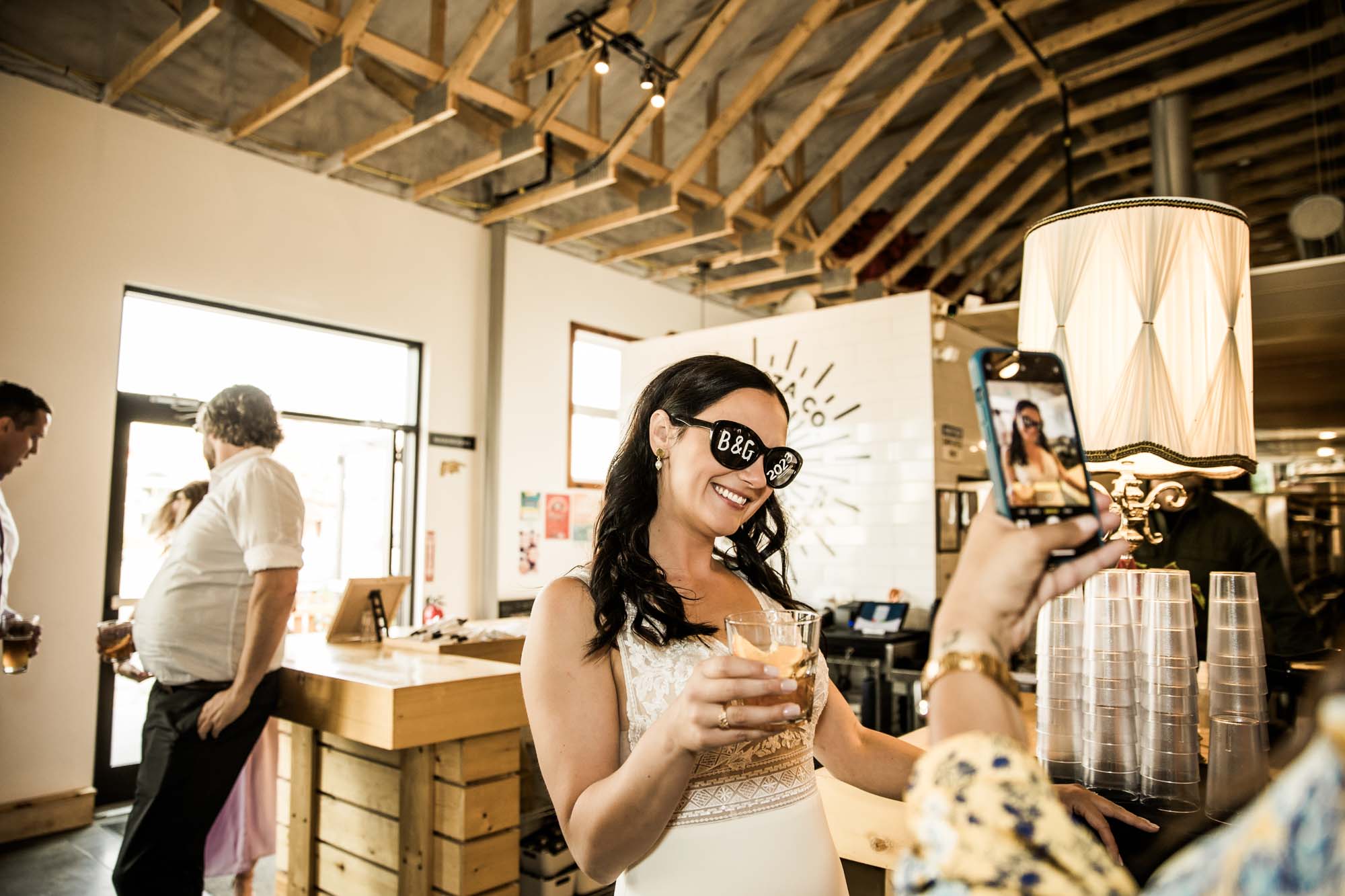 Calgary wedding photographer, candid photos of a micro intimate wedding at Two House Brewery small casual restaurant downtown Calgary