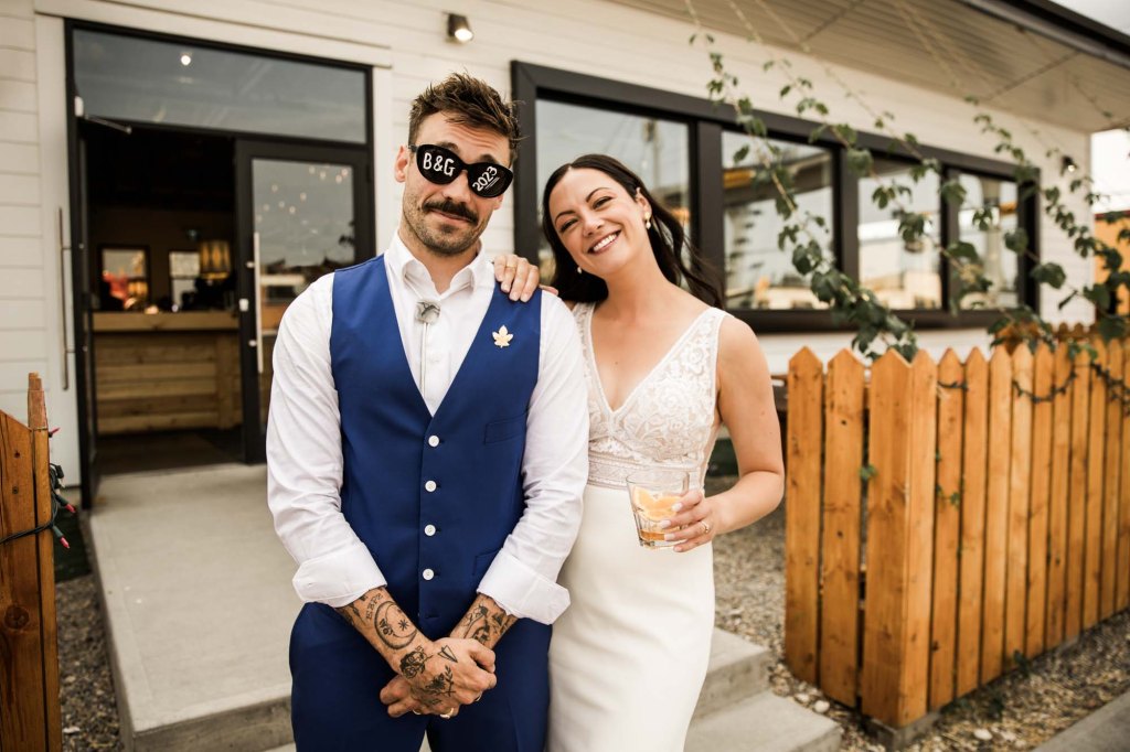 Calgary wedding photographer, candid photos of a micro intimate wedding at Two House Brewery small casual restaurant downtown Calgary