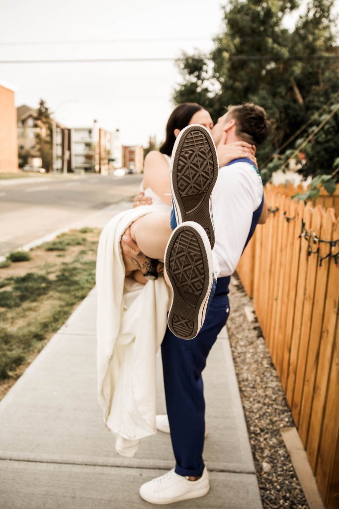 Calgary wedding photographer, candid photos of a micro intimate wedding at Two House Brewery small casual restaurant downtown Calgary