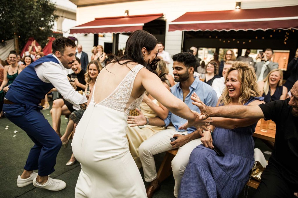 Calgary wedding photographer, candid photos of a micro intimate wedding at Two House Brewery small casual restaurant downtown Calgary