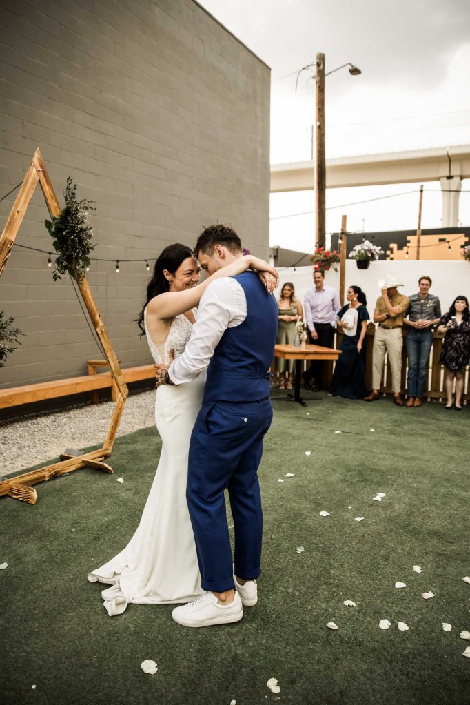 Calgary wedding photographer, candid photos of a micro intimate wedding at Two House Brewery small casual restaurant downtown Calgary