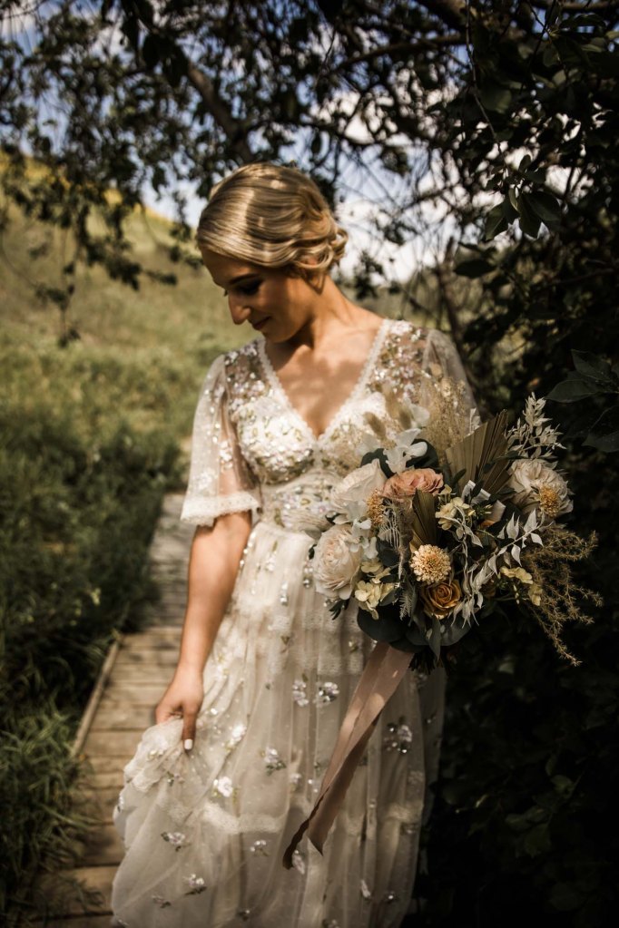 Wild Rose Brewery Calgary Wedding Photographer, couple on their wedding day at Bowmont Park, the Botanical Gardens of Silver Springs and Wild Rose Brewery