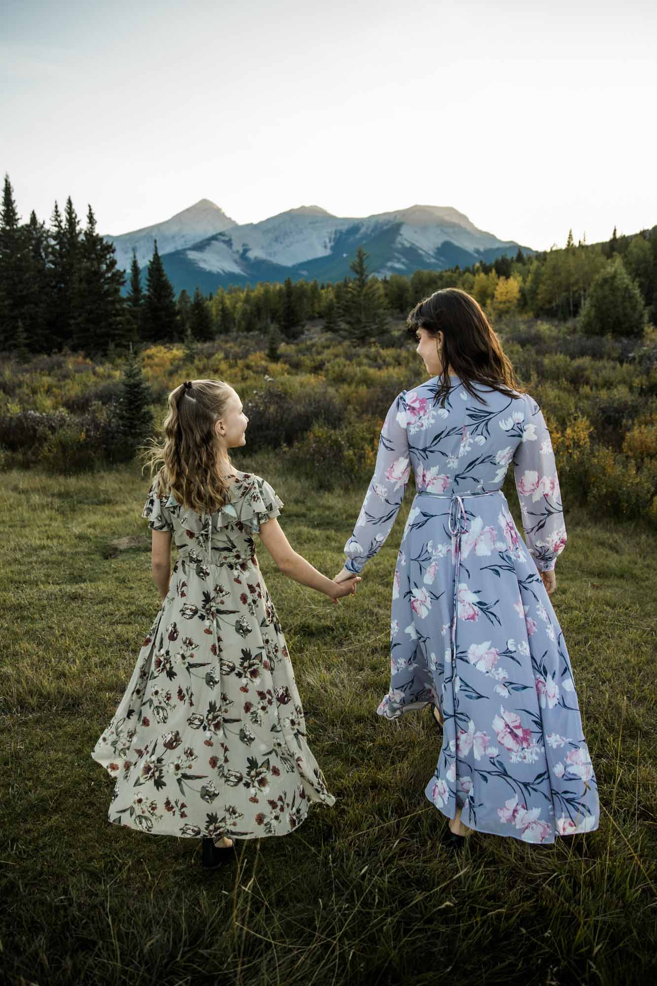Calgary, Banff, Kananaskis Country family photographer, family in front of water and mountains during their photoshoot