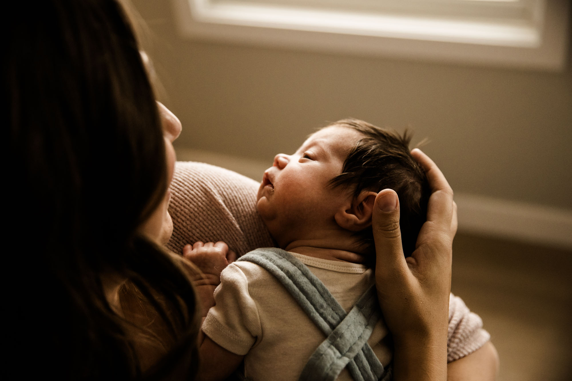 Calgary in-home lifesetyle newborn and maternity photographer, photos of a new baby during his newborn photoshoot
