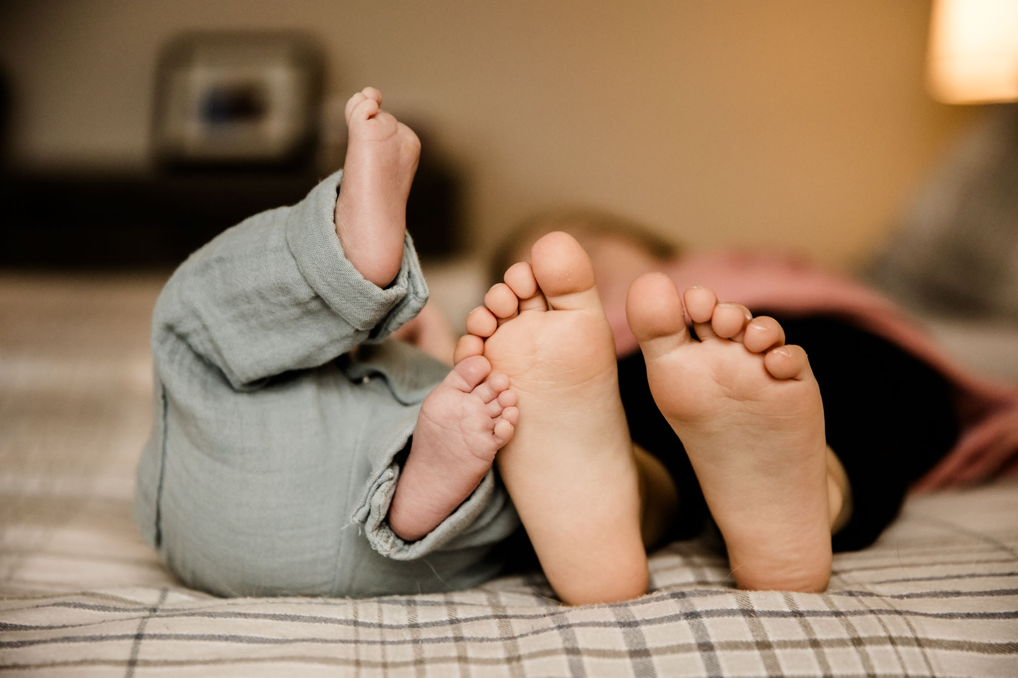 Calgary in-home lifesetyle newborn and maternity photographer, photos of a new baby during his newborn photoshoot