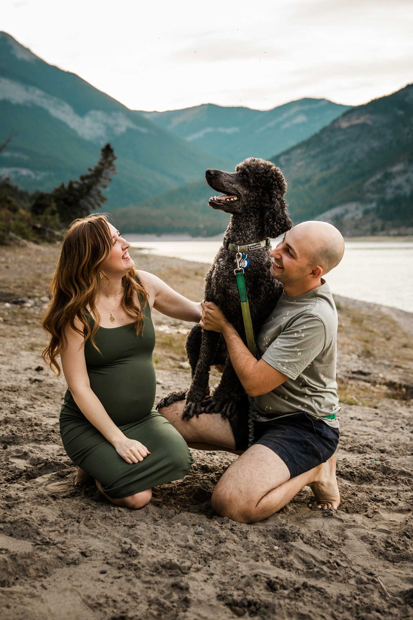 Calgary, Banff, Kananaskis Country maternity, family, newborn photographer, couple in front of the mountains during their maternity photoshoot in Kananaskis Country