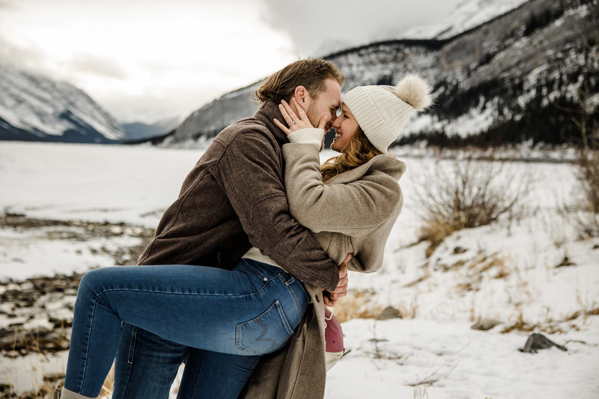 Calgary, Banff, Canmore, Kananaskis Country wedding photographer, photos of a couple during their engagement session photoshoot in the mountains in Kananaskis Country during the winter