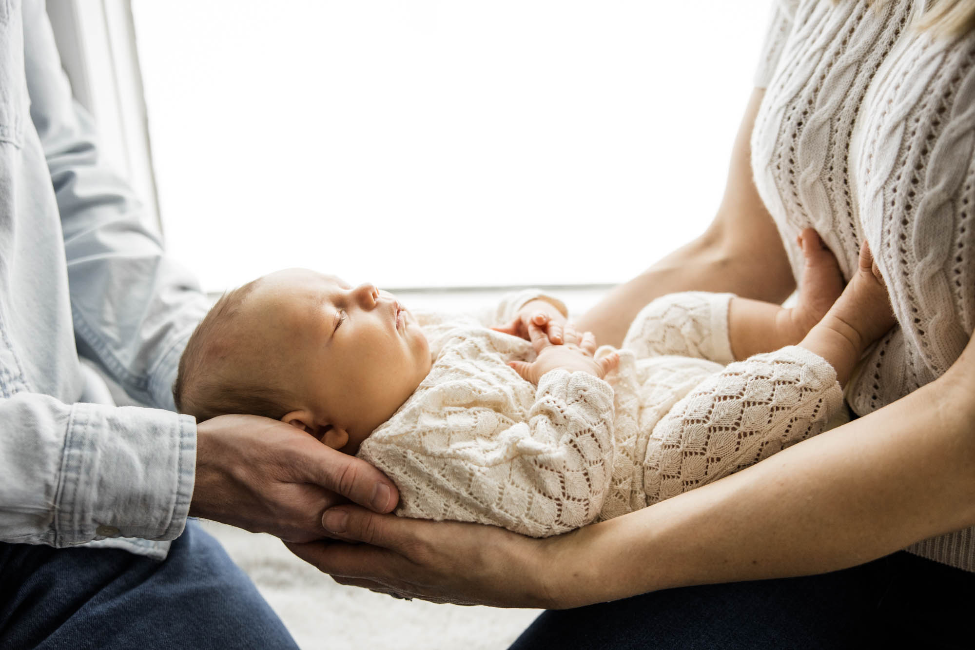 Calgary lifestyle newborn and maternity photographer, family in their home during a newborn photo session with their new baby, lifestyle photos and posed basket photos