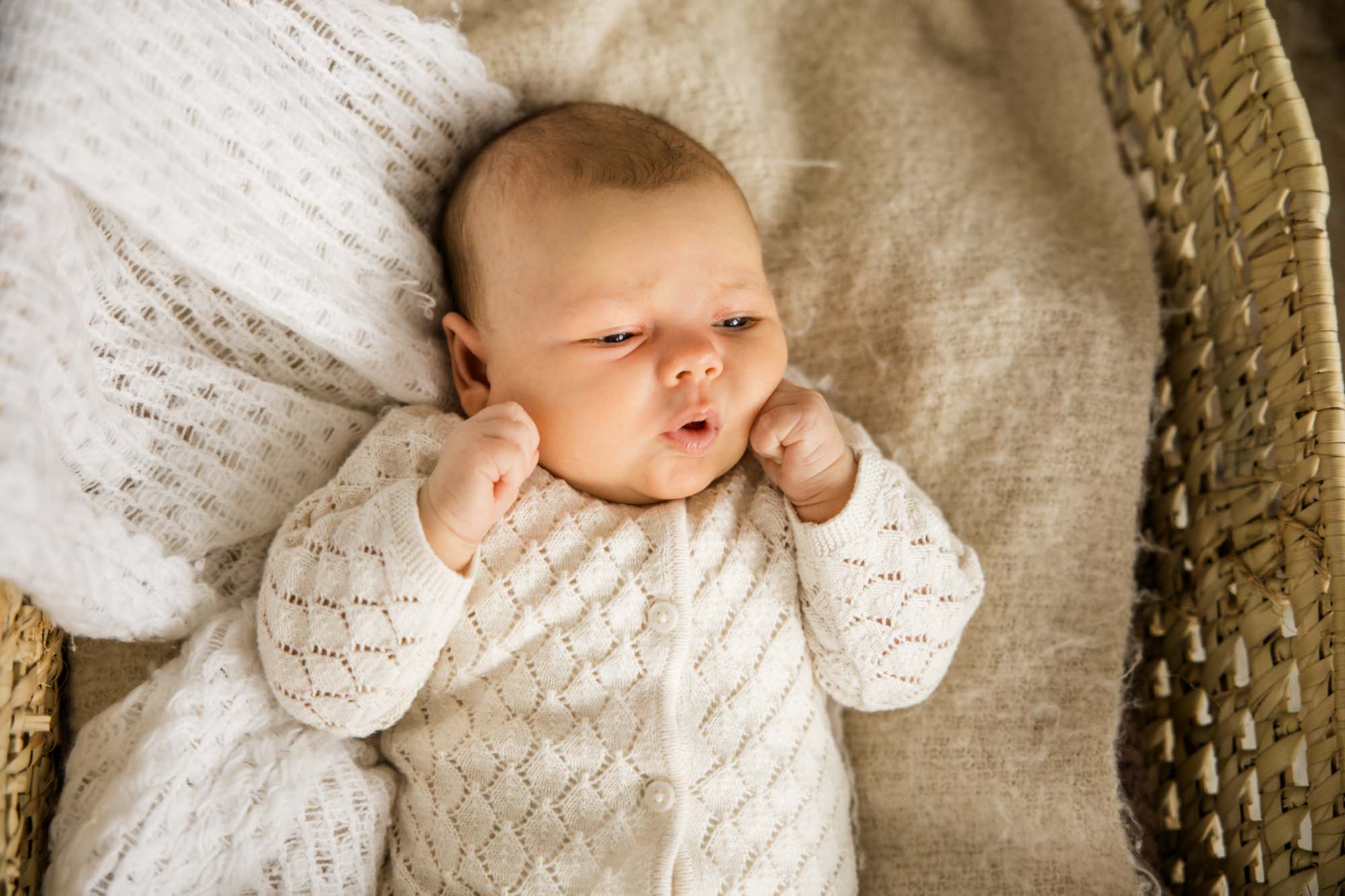 Calgary lifestyle newborn and maternity photographer, family in their home during a newborn photo session with their new baby, lifestyle photos and posed basket photos