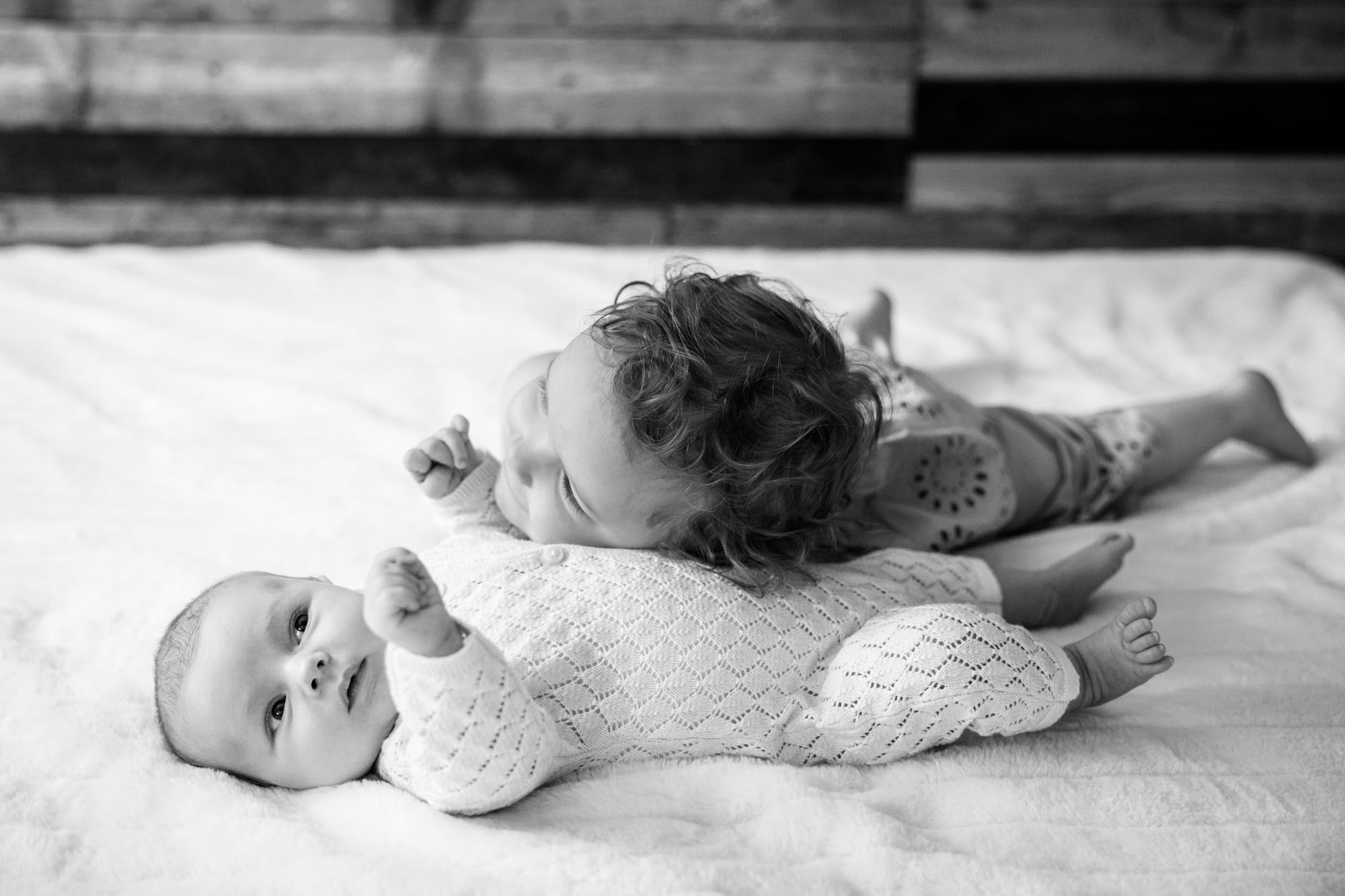 Calgary lifestyle newborn and maternity photographer, family in their home during a newborn photo session with their new baby, lifestyle photos and posed basket photos