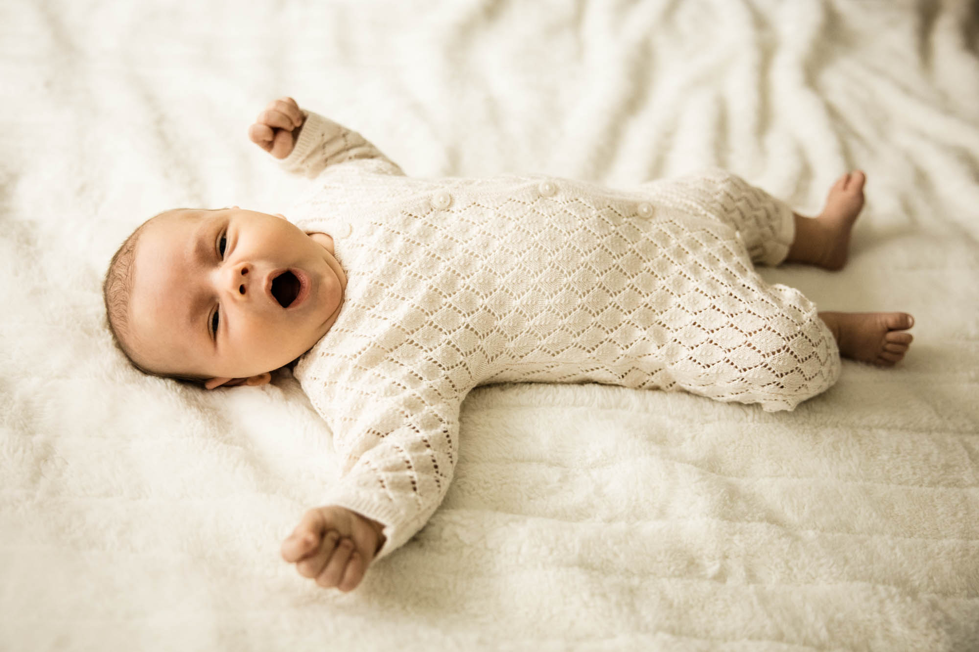 Calgary lifestyle newborn and maternity photographer, family in their home during a newborn photo session with their new baby, lifestyle photos and posed basket photos