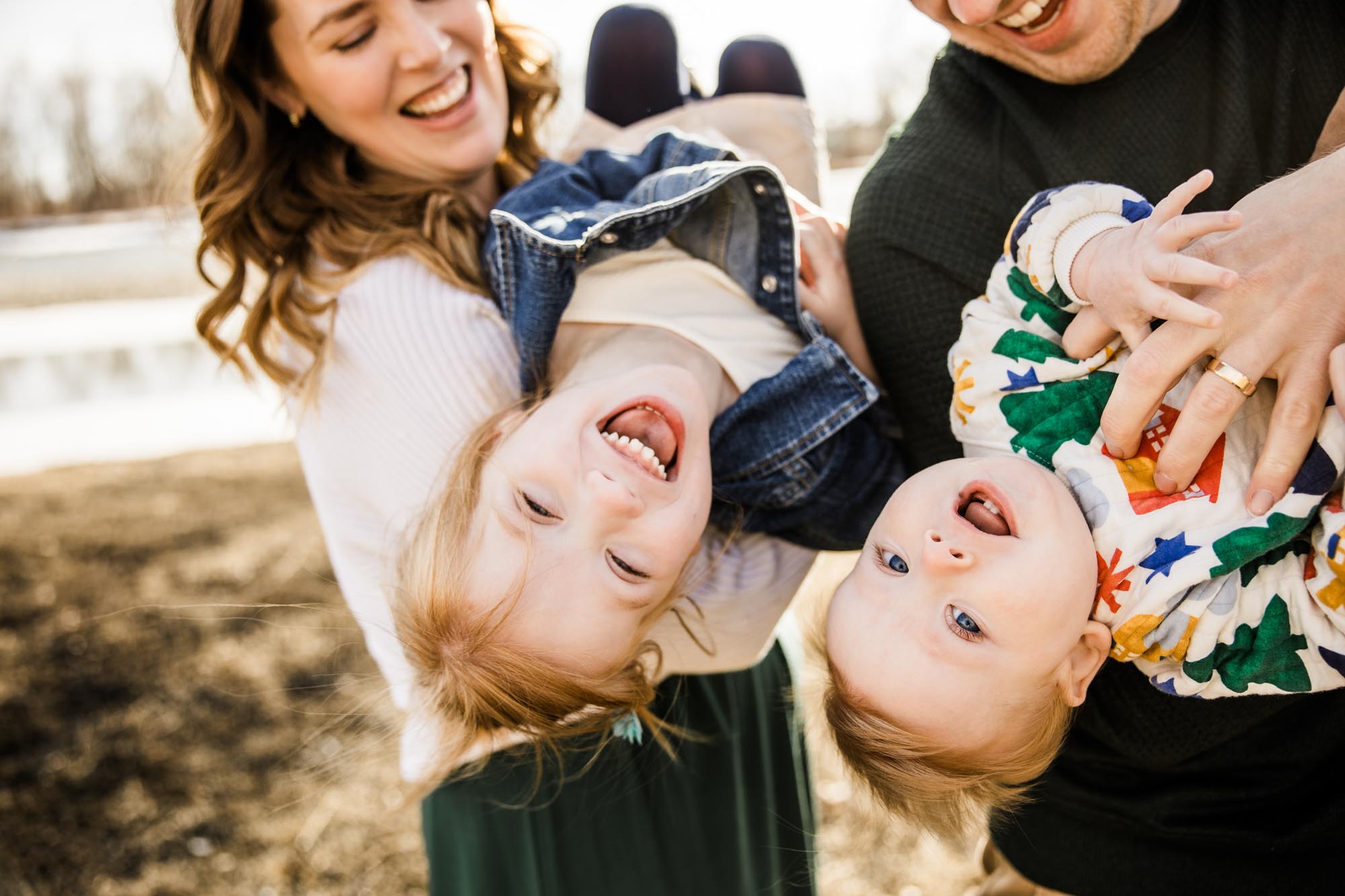 Calgary family photographer, mini session, family during their photoshoot in front of the Bow River at Carburn Park