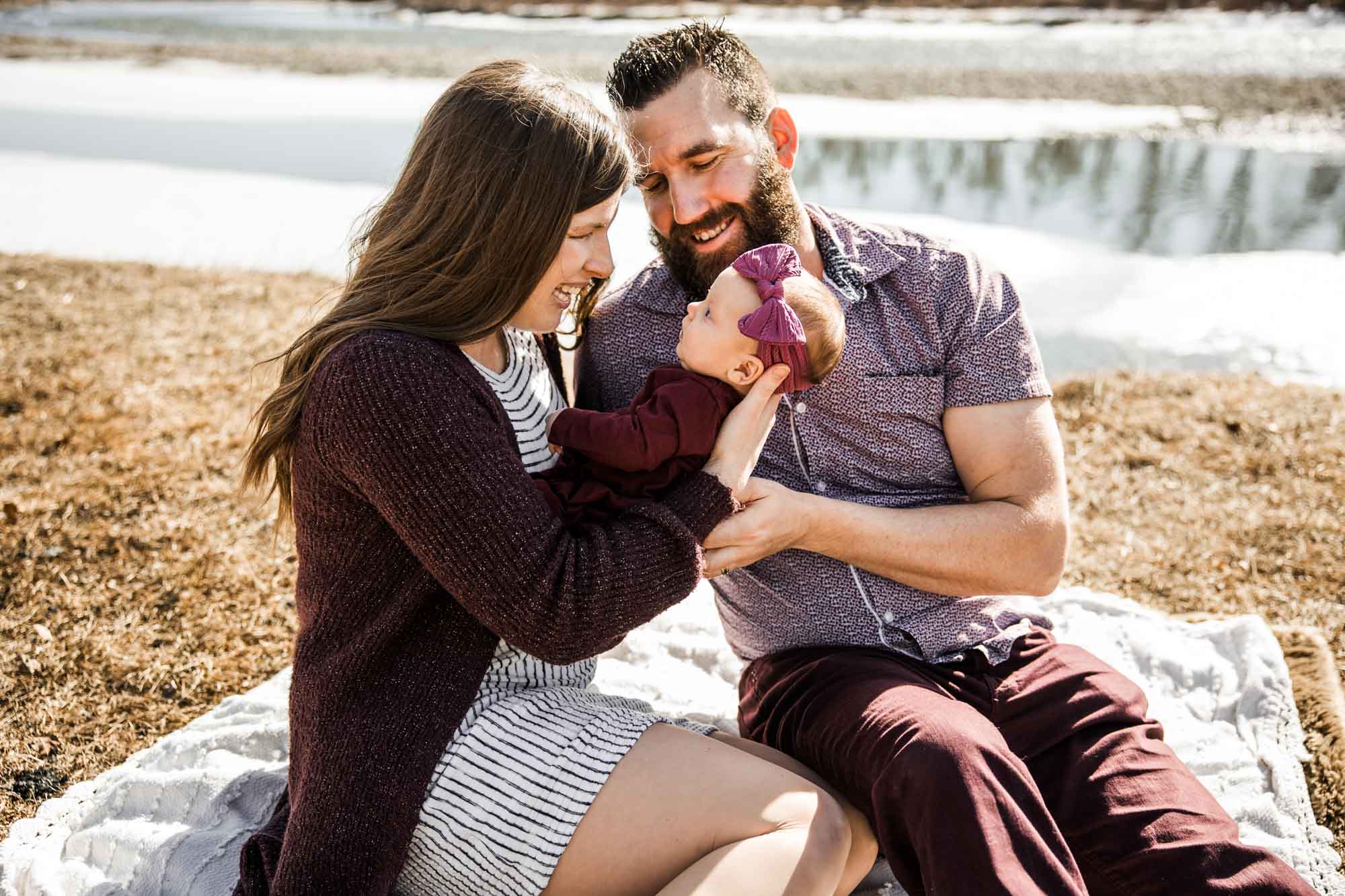 Calgary family photographer, mini session, family during their photoshoot in front of the Bow River at Carburn Park