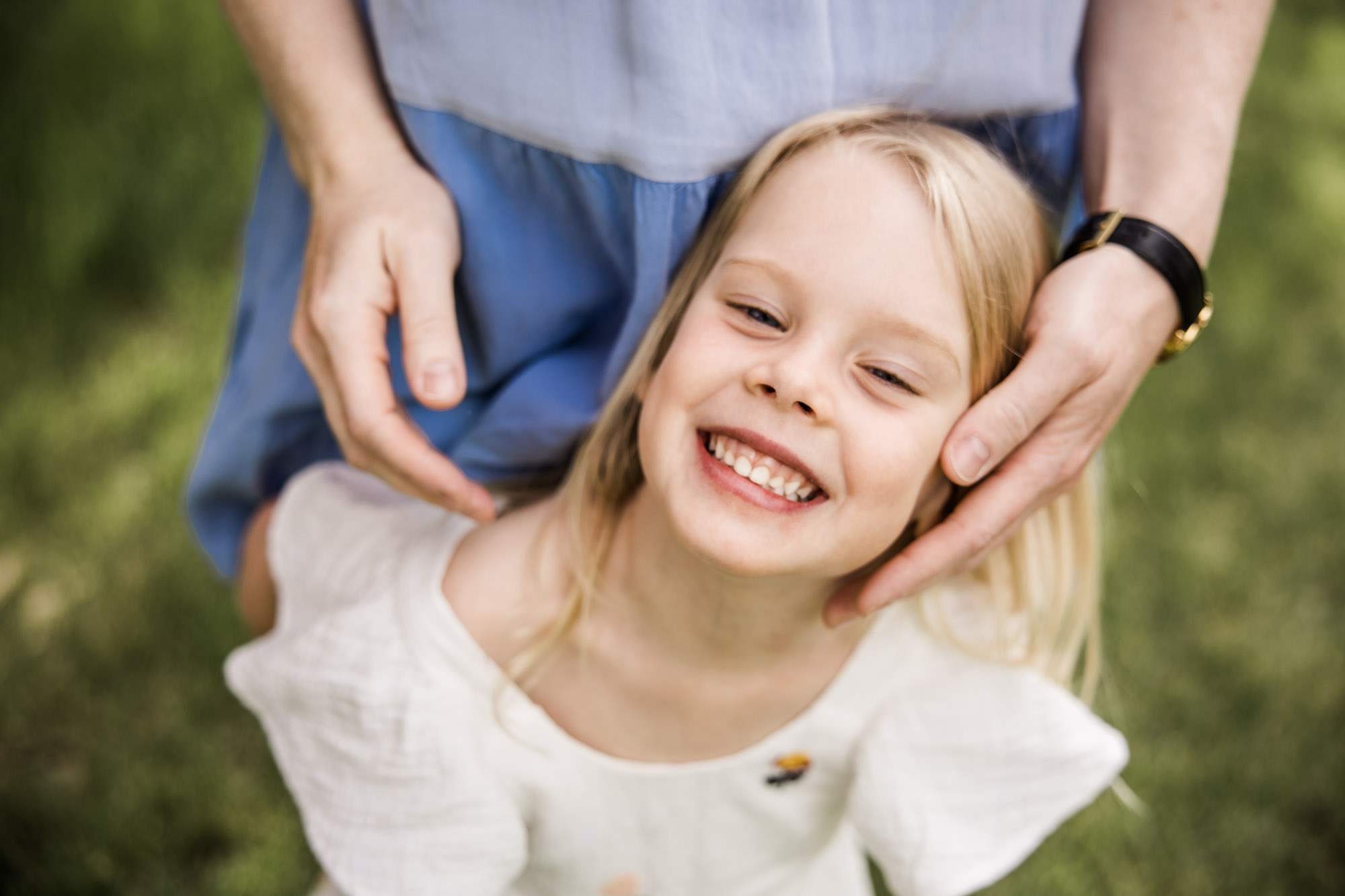 Calgary family photographer, family during their mini session at Baker Park around the cherry blossom trees
