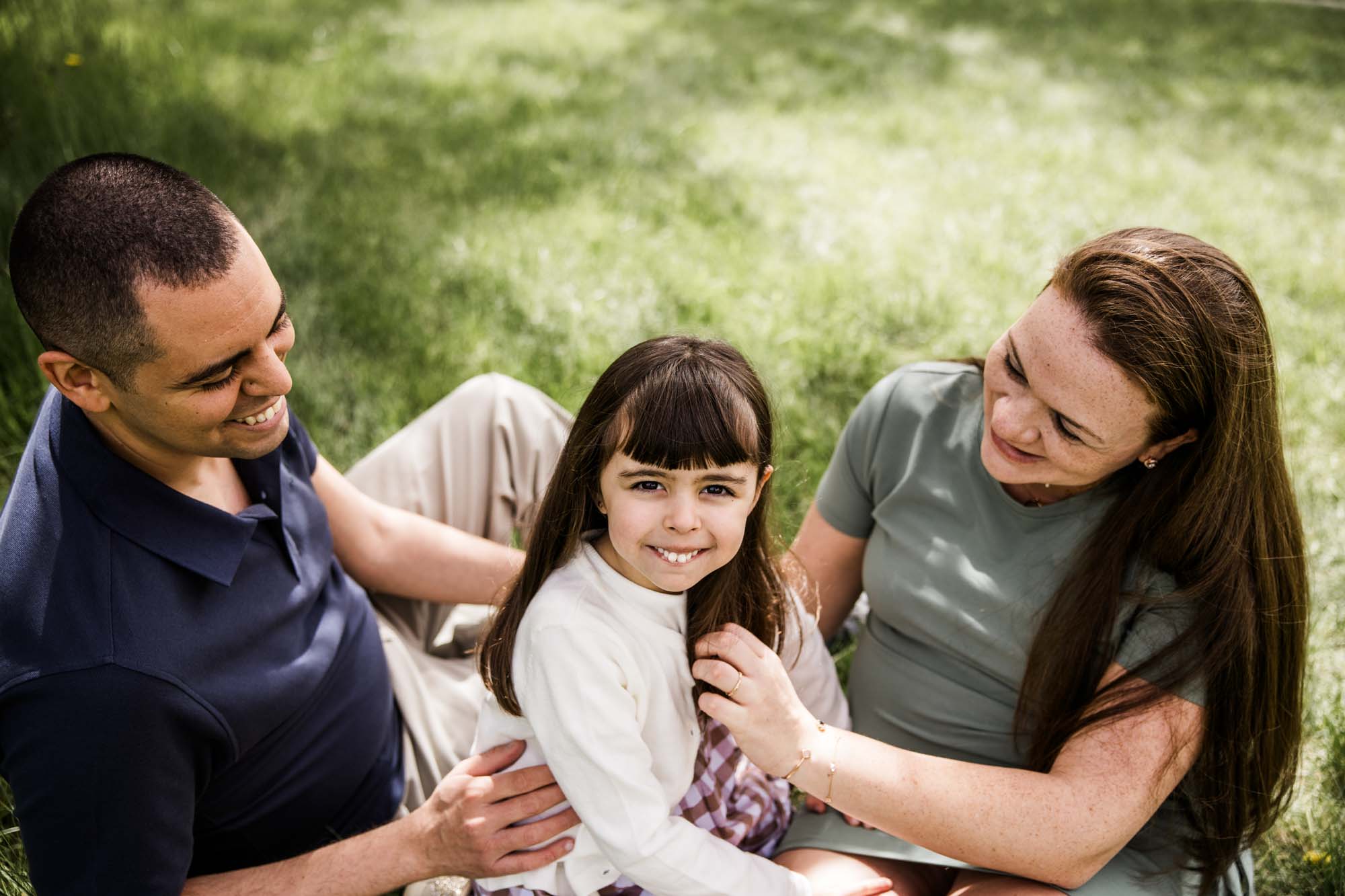 Calgary family photographer, family during their mini session at Baker Park around the cherry blossom trees