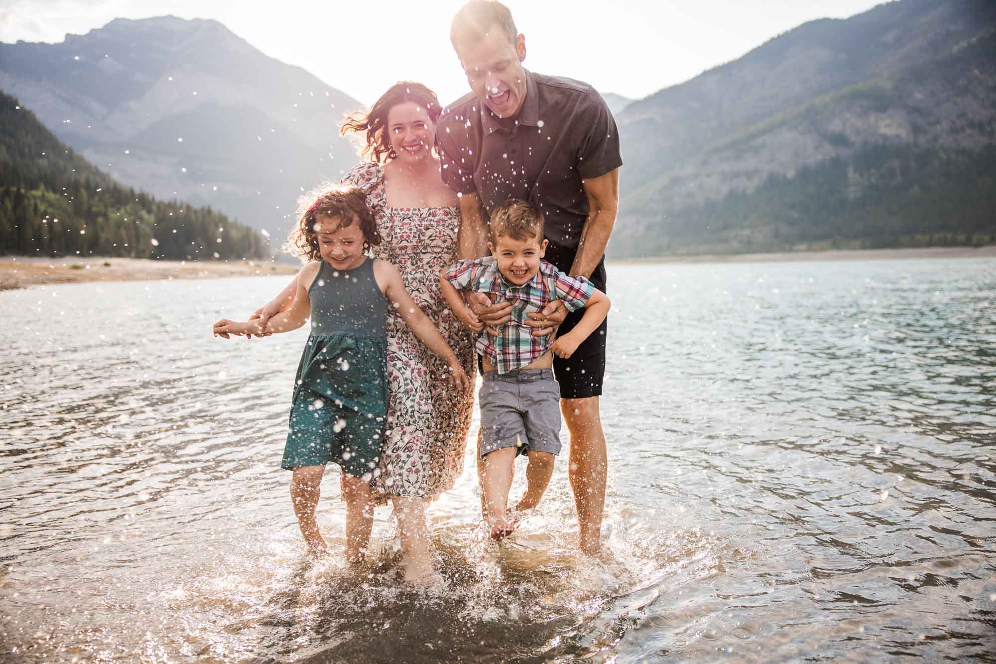 Calgary, Banff, Canmore, Kananaskis Country lifestyle family photographer, family in front of the mountains in the Canadian Rockies during their mini session photoshoot