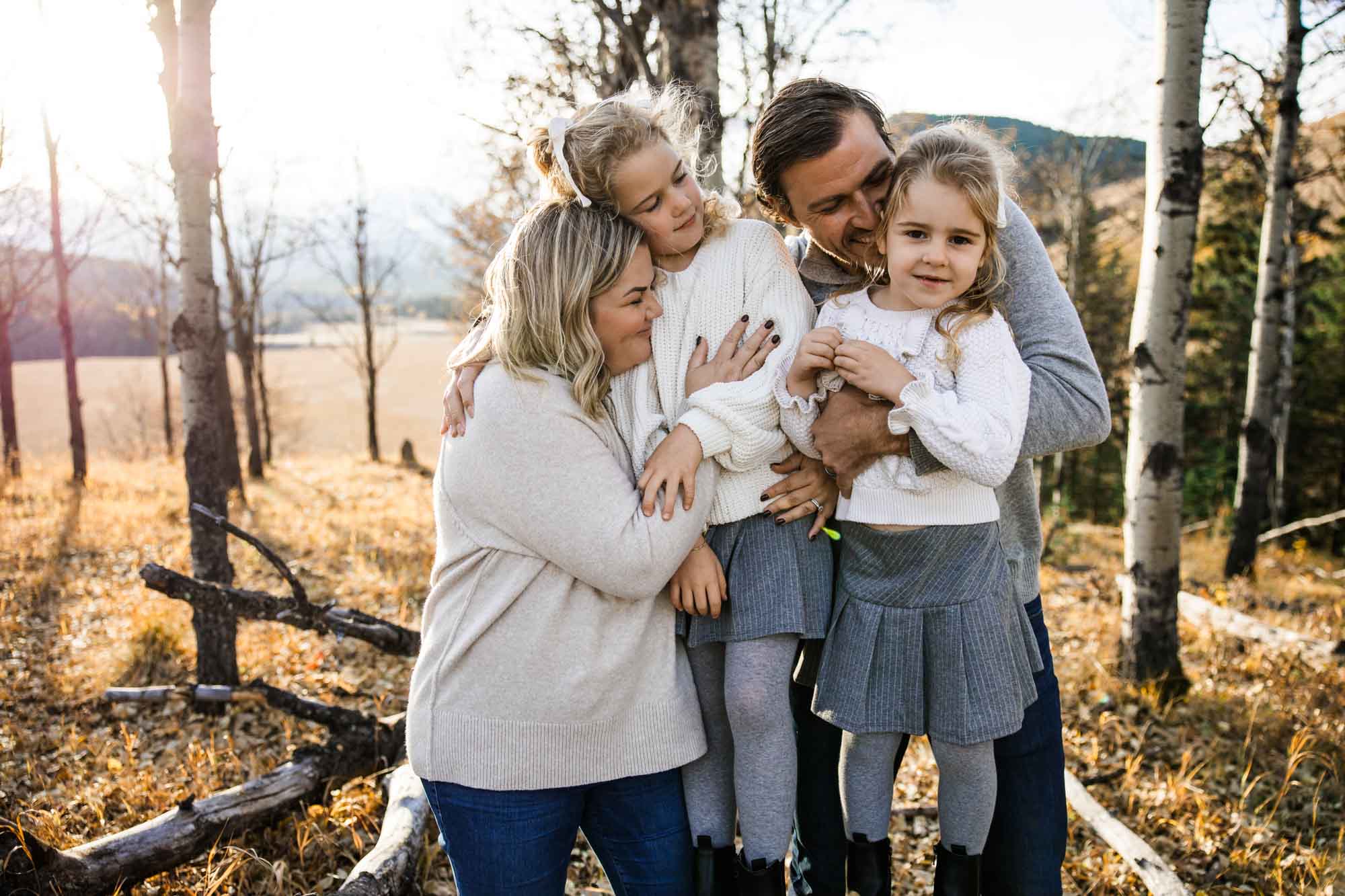 Calgary, Banff, Canmore, Kananaskis lifestyle family photographer, family in the mountains at sunset suring their photoshoot, with real candid documentary style