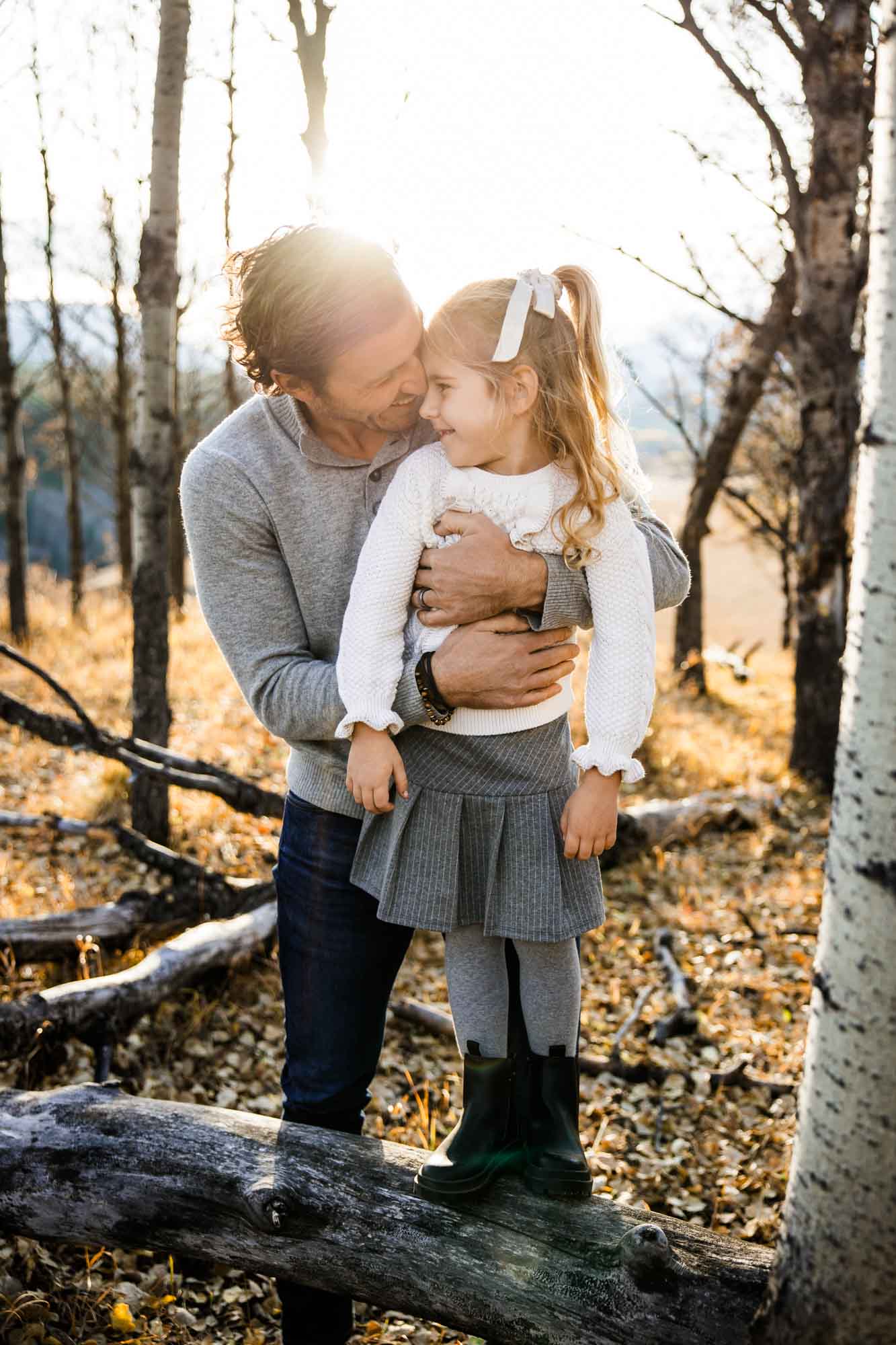 Calgary, Banff, Canmore, Kananaskis lifestyle family photographer, family in the mountains at sunset suring their photoshoot, with real candid documentary style