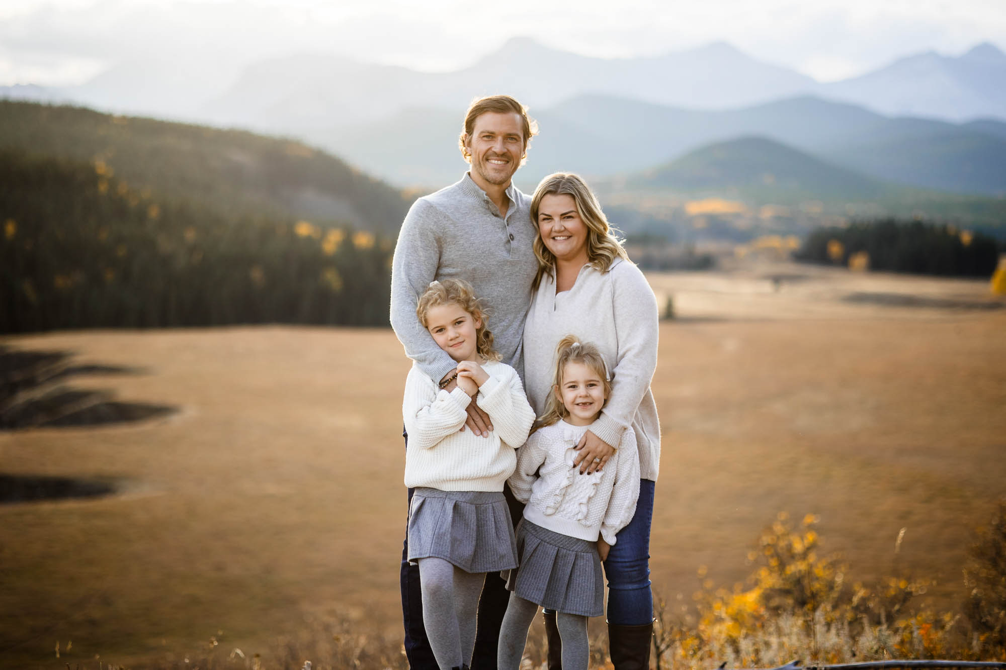 Calgary, Banff, Canmore, Kananaskis lifestyle family photographer, family in the mountains at sunset suring their photoshoot, with real candid documentary style