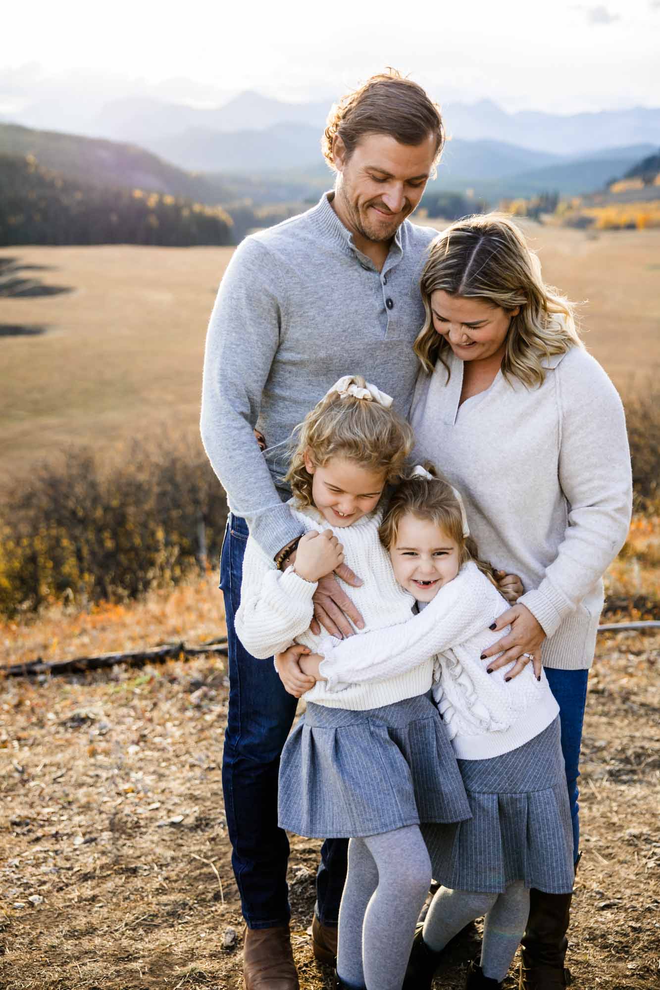 Calgary, Banff, Canmore, Kananaskis lifestyle family photographer, family in the mountains at sunset suring their photoshoot, with real candid documentary style