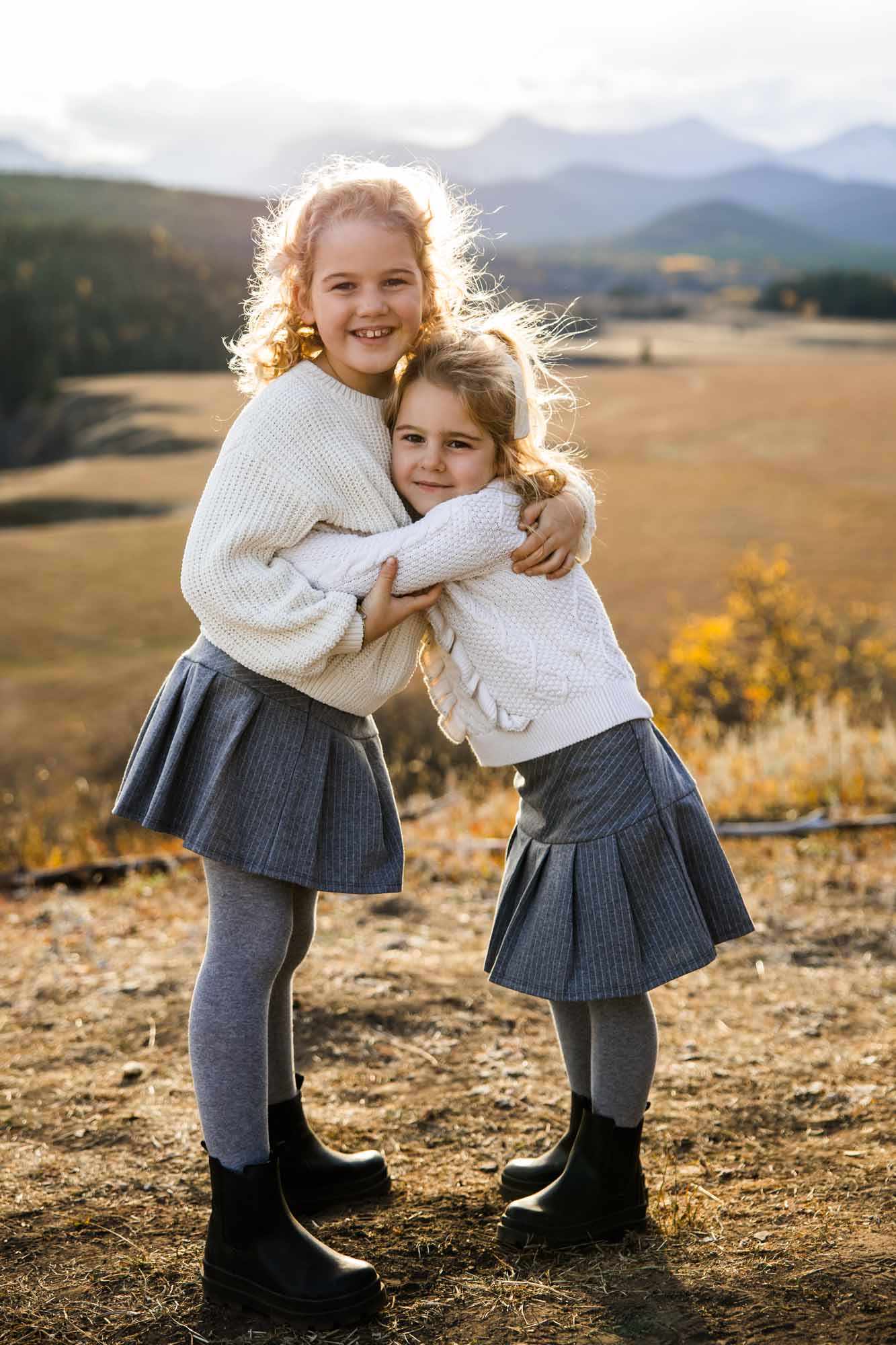 Calgary, Banff, Canmore, Kananaskis lifestyle family photographer, family in the mountains at sunset suring their photoshoot, with real candid documentary style
