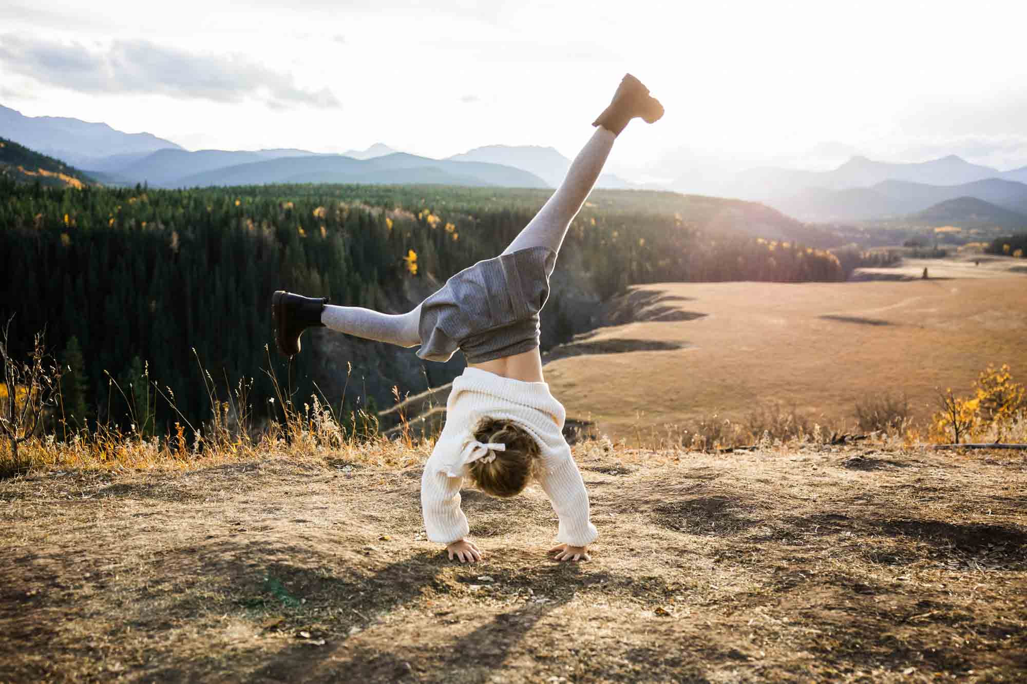 Calgary, Banff, Canmore, Kananaskis lifestyle family photographer, family in the mountains at sunset suring their photoshoot, with real candid documentary style