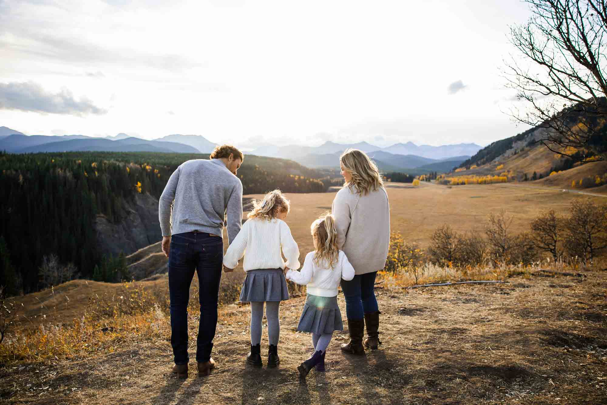 Calgary, Banff, Canmore, Kananaskis lifestyle family photographer, family in the mountains at sunset suring their photoshoot, with real candid documentary style