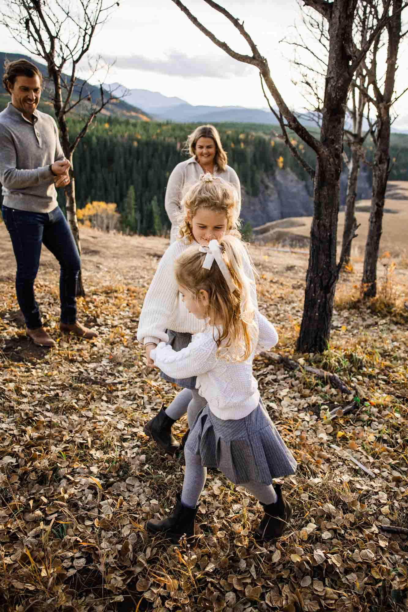 Calgary, Banff, Canmore, Kananaskis lifestyle family photographer, family in the mountains at sunset suring their photoshoot, with real candid documentary style
