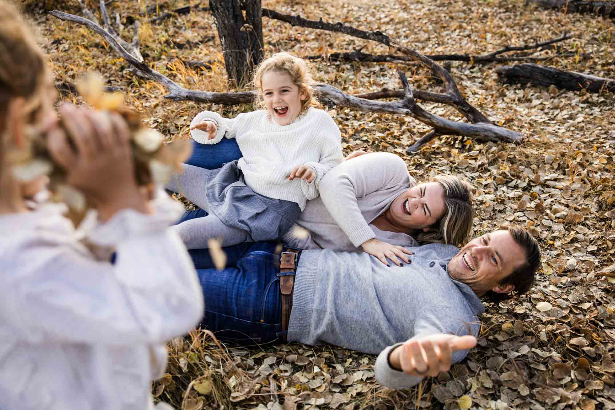 Calgary, Banff, Canmore, Kananaskis lifestyle family photographer, family in the mountains at sunset suring their photoshoot, with real candid documentary style
