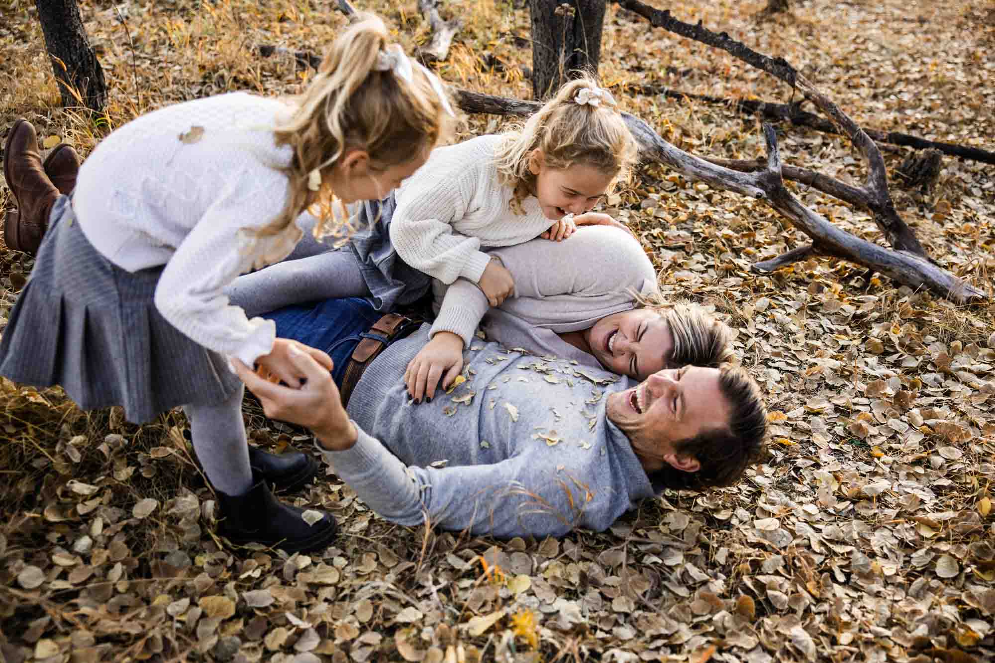 Calgary, Banff, Canmore, Kananaskis lifestyle family photographer, family in the mountains at sunset suring their photoshoot, with real candid documentary style