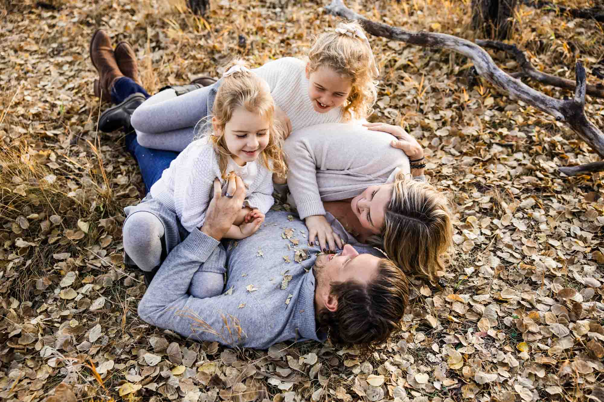 Calgary, Banff, Canmore, Kananaskis lifestyle family photographer, family in the mountains at sunset suring their photoshoot, with real candid documentary style