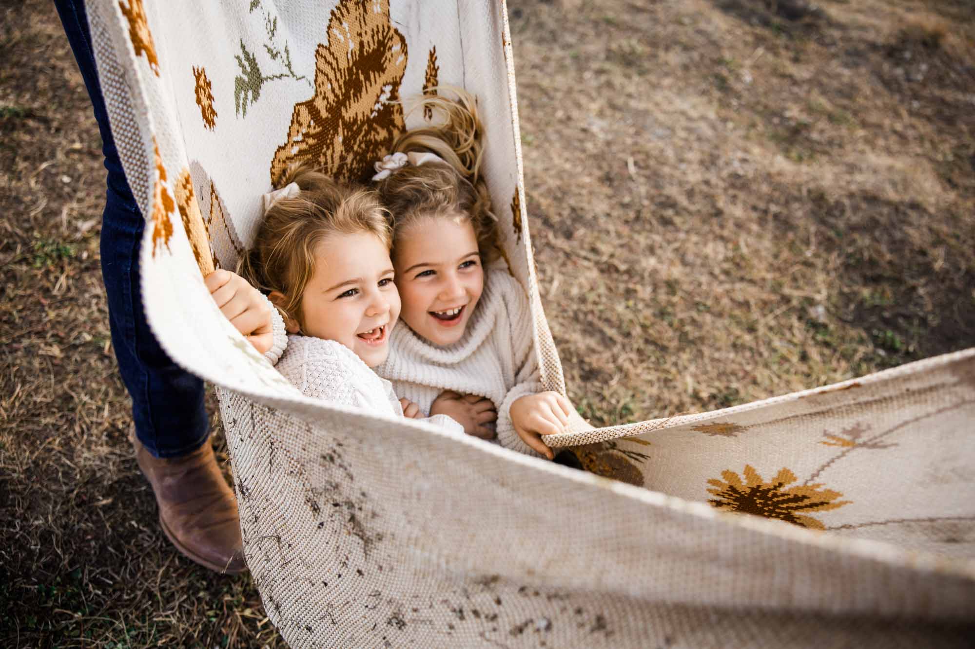 Calgary, Banff, Canmore, Kananaskis lifestyle family photographer, family in the mountains at sunset suring their photoshoot, with real candid documentary style