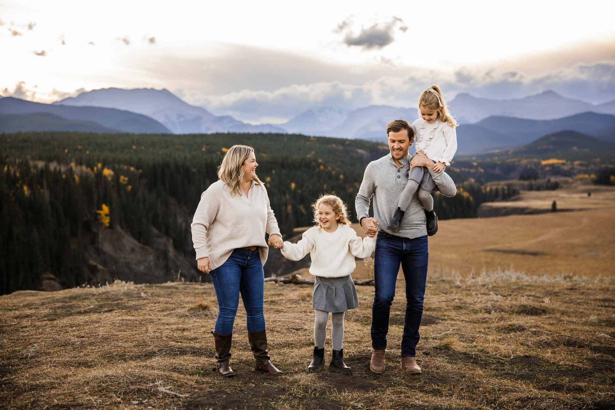 Calgary, Banff, Canmore, Kananaskis lifestyle family photographer, family in the mountains at sunset suring their photoshoot, with real candid documentary style