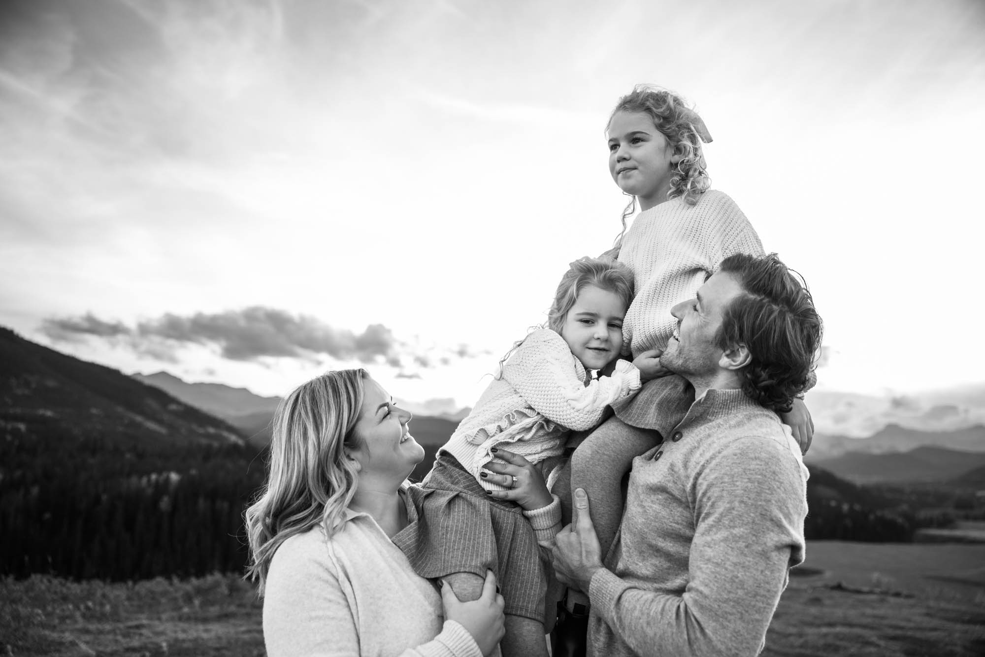 Calgary, Banff, Canmore, Kananaskis lifestyle family photographer, family in the mountains at sunset suring their photoshoot, with real candid documentary style