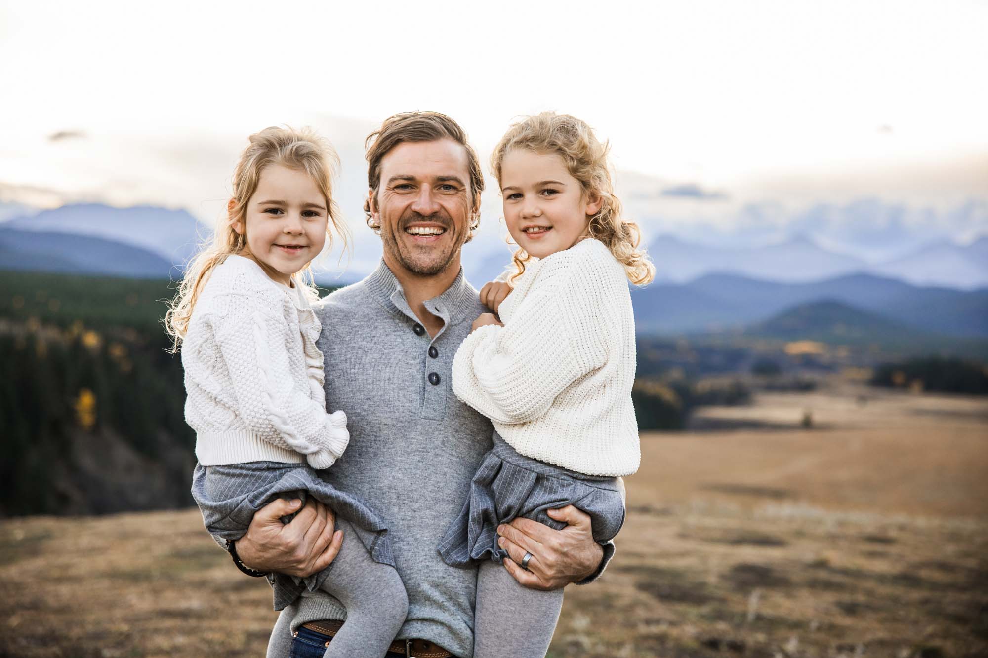 Calgary, Banff, Canmore, Kananaskis lifestyle family photographer, family in the mountains at sunset suring their photoshoot, with real candid documentary style