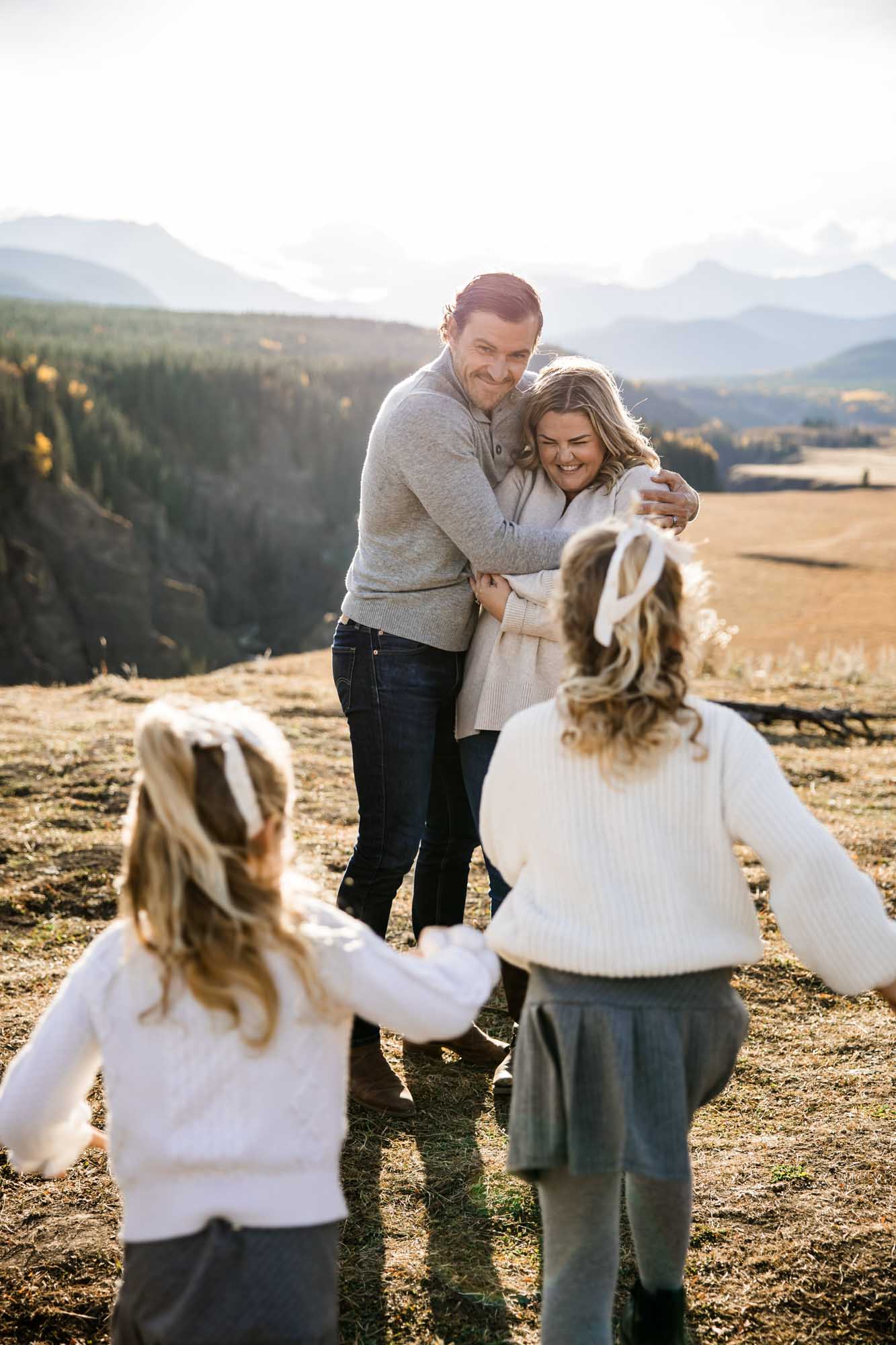 Calgary, Banff, Canmore, Kananaskis lifestyle family photographer, family in the mountains at sunset suring their photoshoot, with real candid documentary style