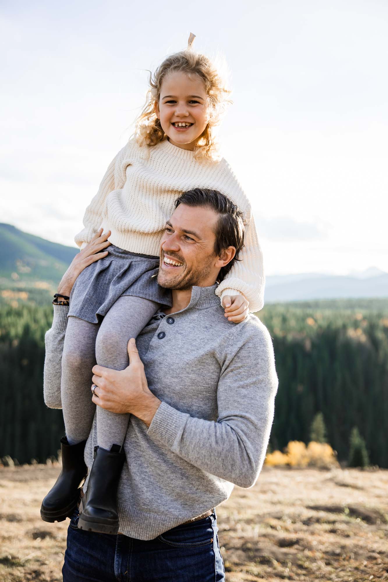 Calgary, Banff, Canmore, Kananaskis lifestyle family photographer, family in the mountains at sunset suring their photoshoot, with real candid documentary style