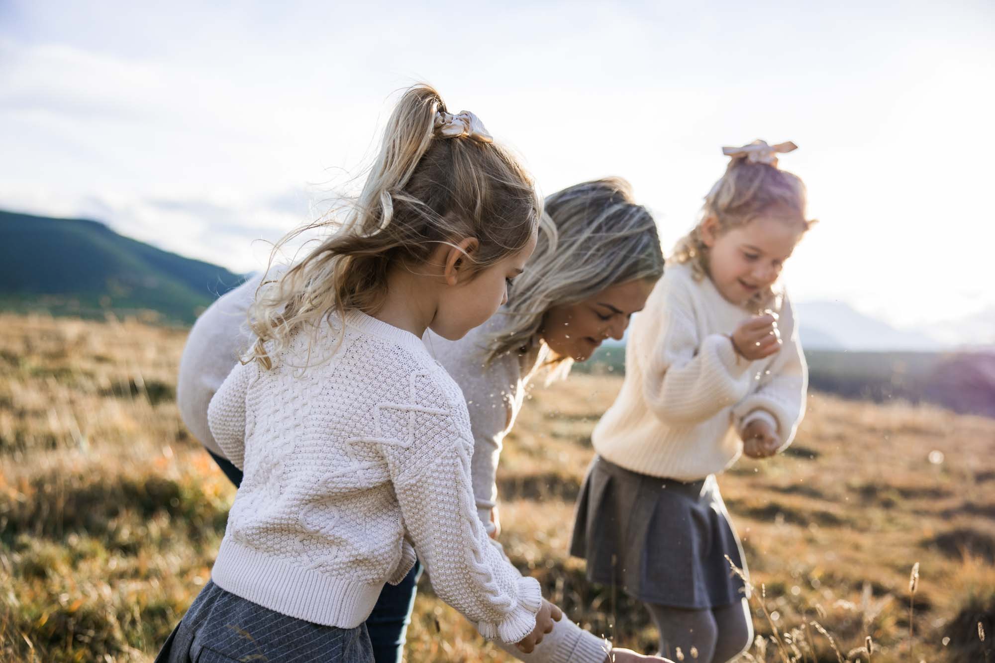 Calgary, Banff, Canmore, Kananaskis lifestyle family photographer, family in the mountains at sunset suring their photoshoot, with real candid documentary style